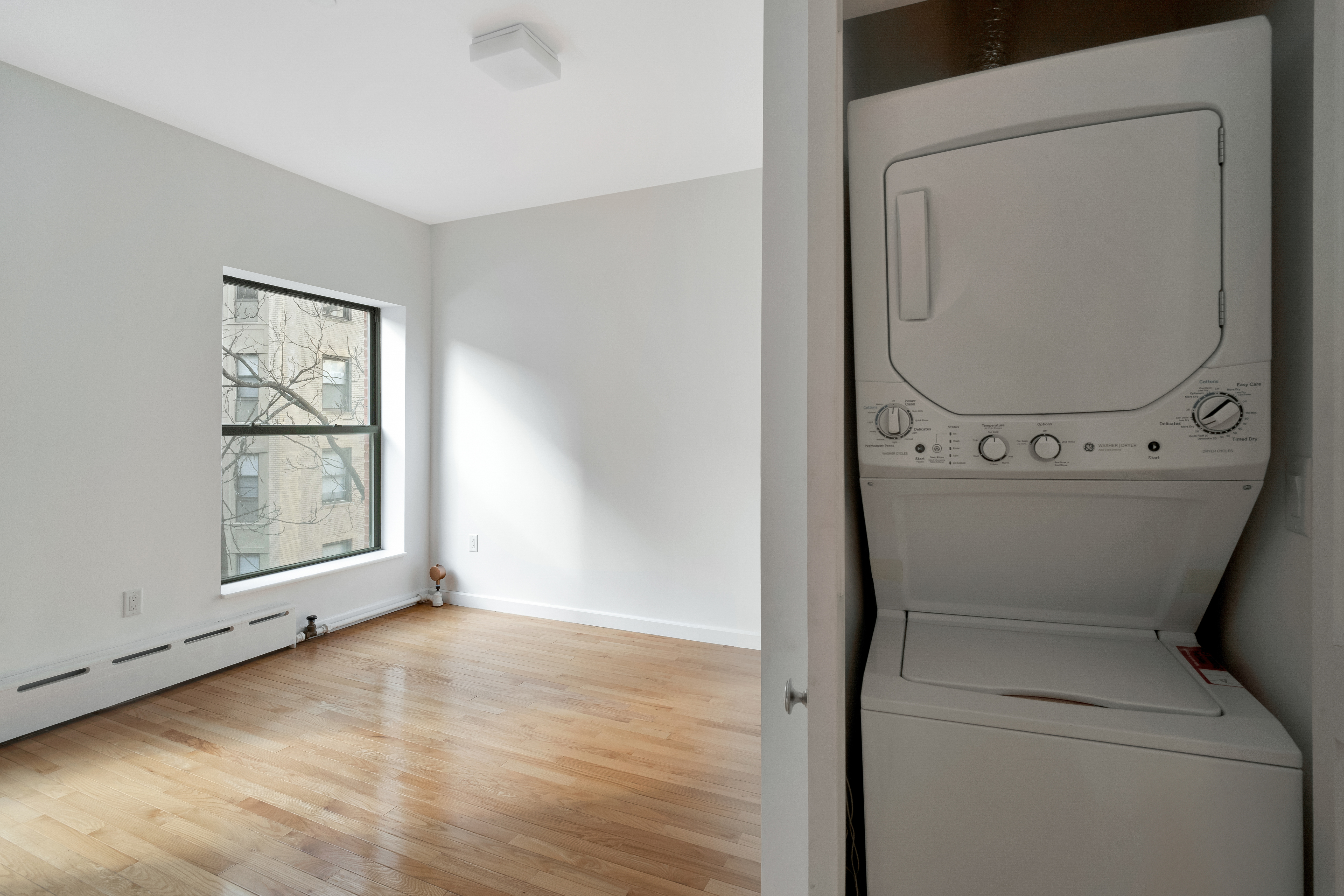 228 West 75th Street, Unit 4 Manhattan, NY 10023 - Photo 7 of 13 a utility room with dryer and washer