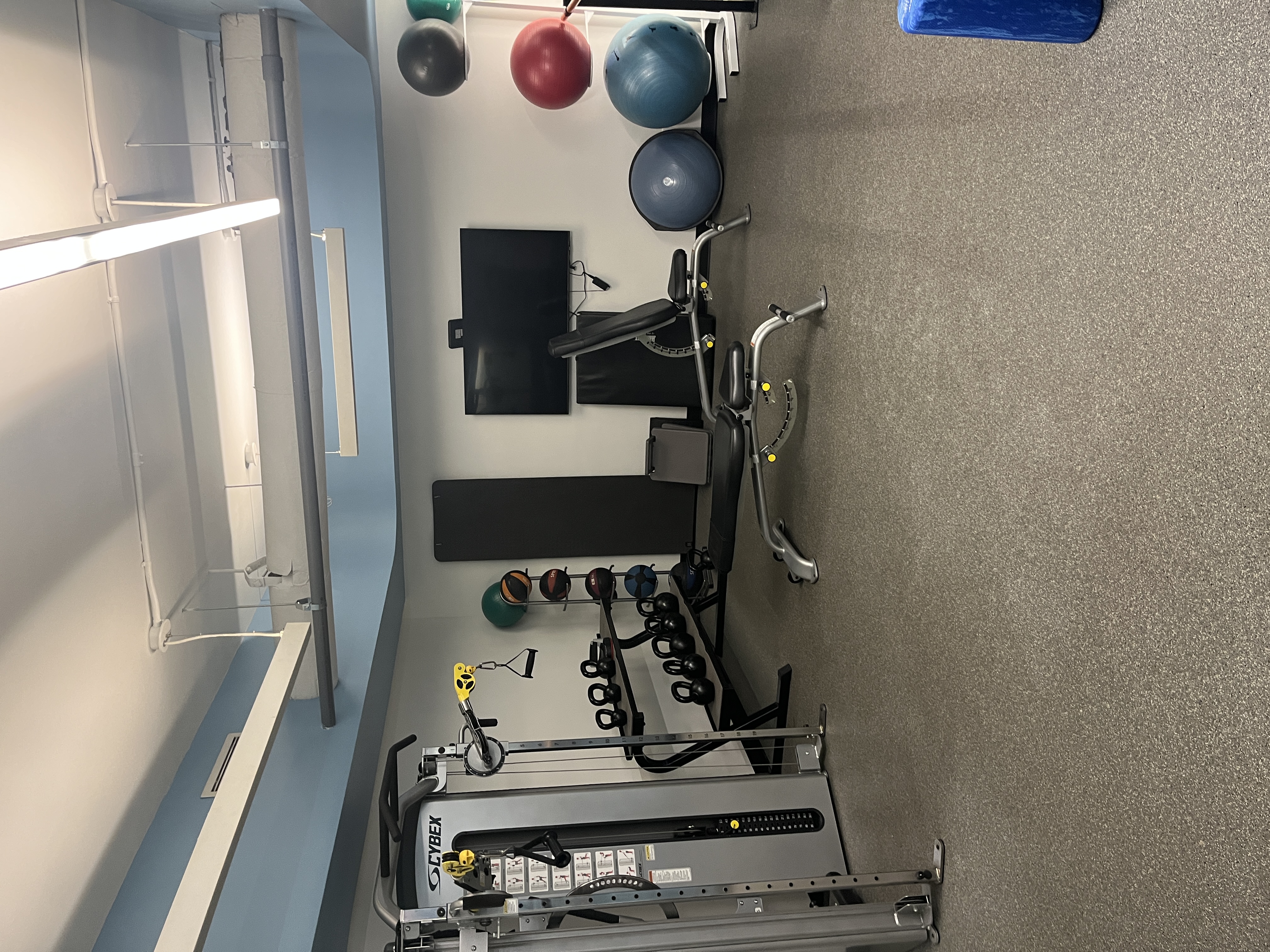 400 East 85th Street, Unit 15A Manhattan, NY 10028 - Photo 10 of 11 a view of a room with gym equipment