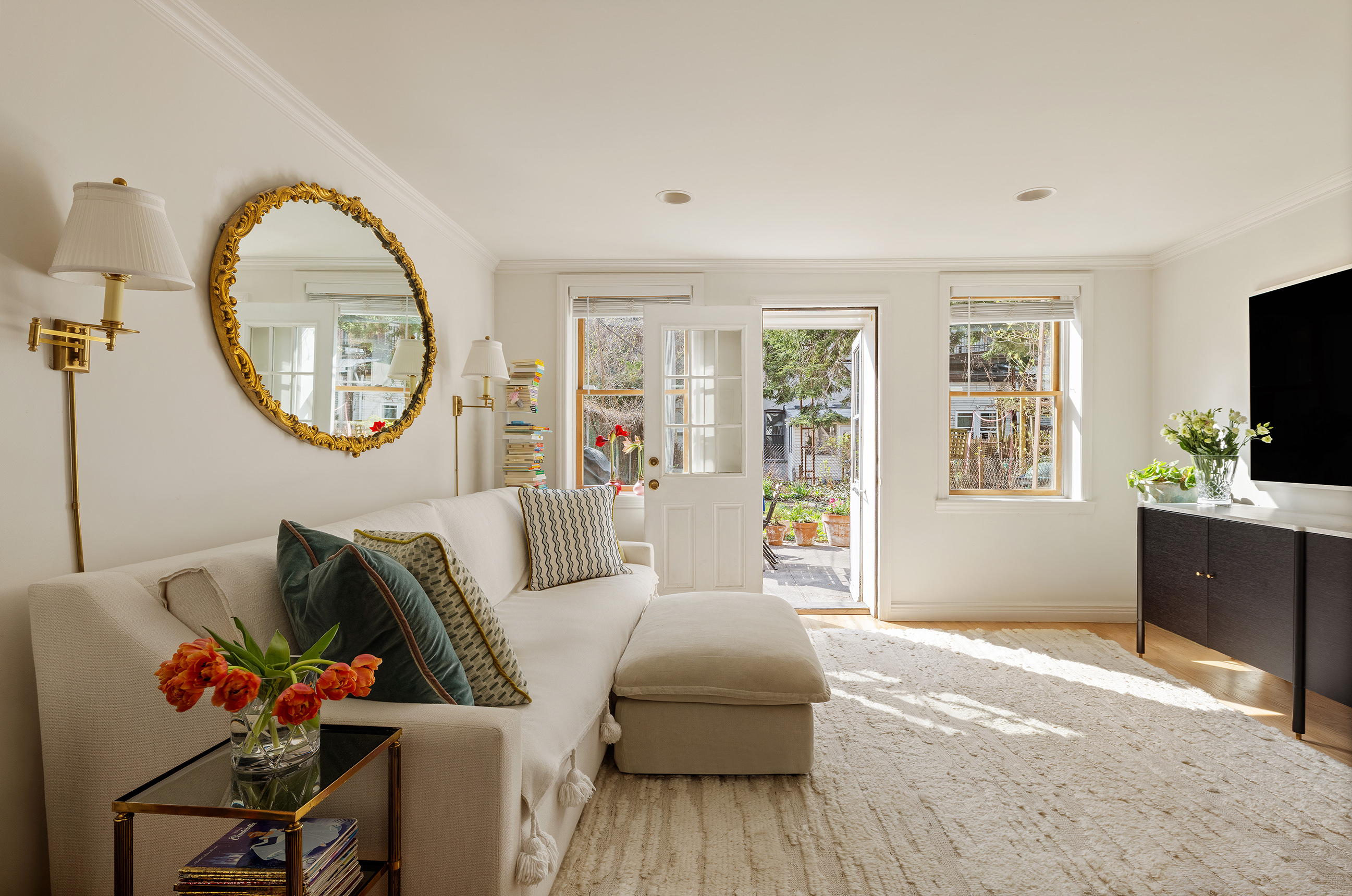 a living room with furniture and a flat screen tv