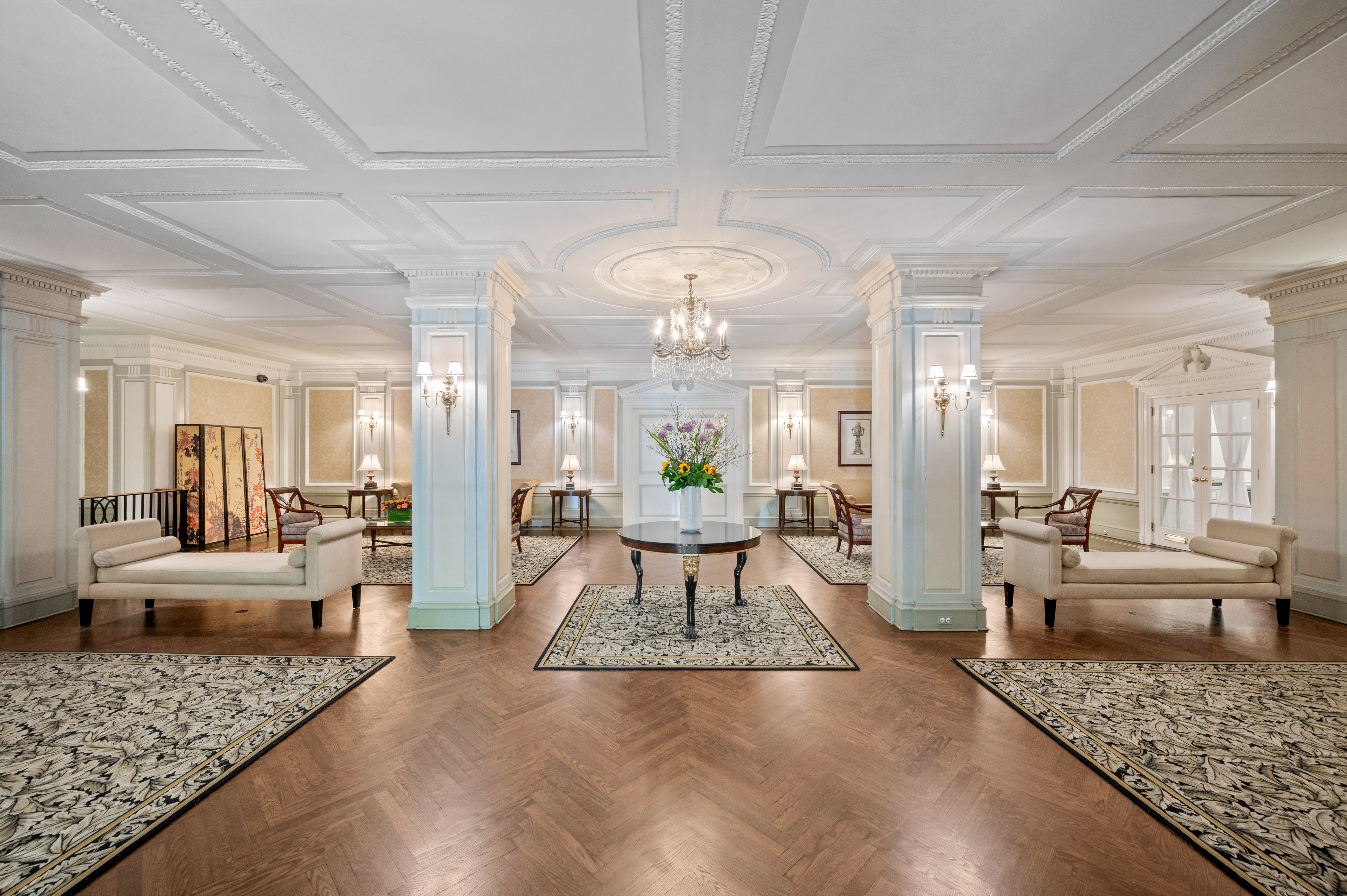 225 Central Park West, Unit 905/906 Manhattan, NY 10024 - Photo 10 of 12 a living room with furniture and a chandelier