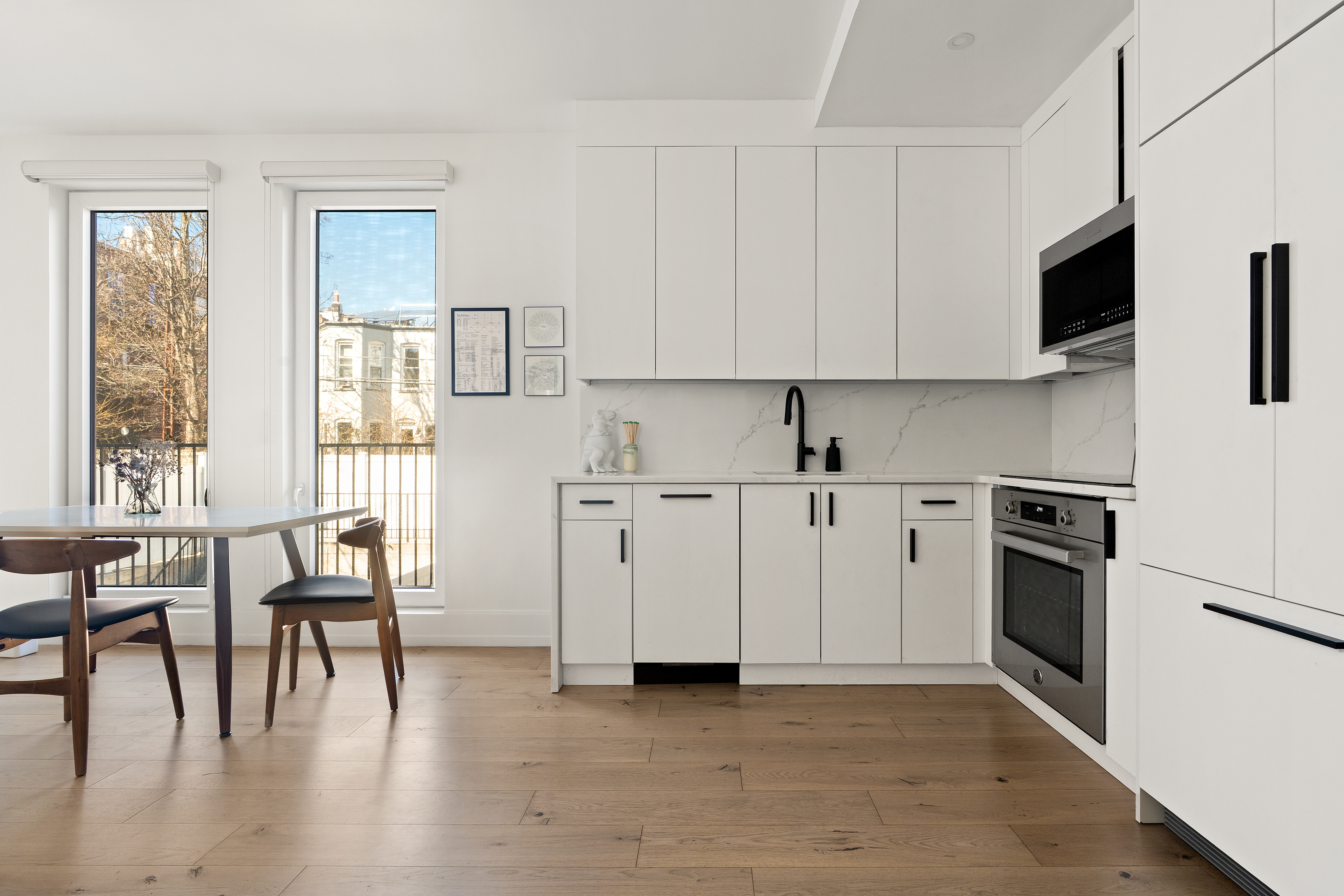 237 Rutland Road, Unit 1B Brooklyn, NY 11225 - Photo 2 of 9 a view of kitchen with furniture and wooden floor