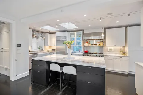 a view of staircase with white walls