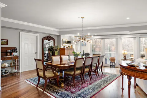 a living room with lots of furniture and clutter