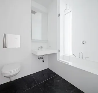 a bathroom with a sink toilet and vanity