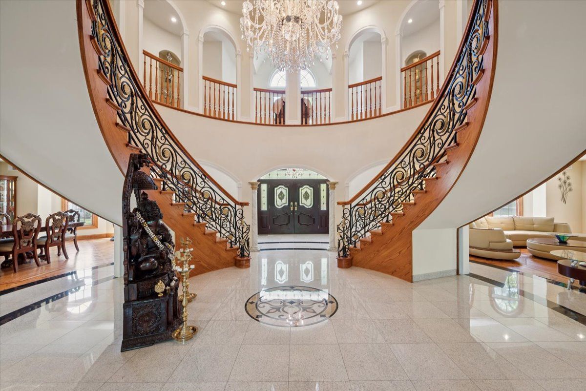 a dining room with furniture window and wooden floor