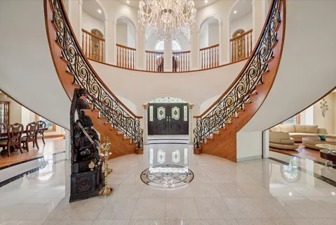 a dining room with furniture window and wooden floor
