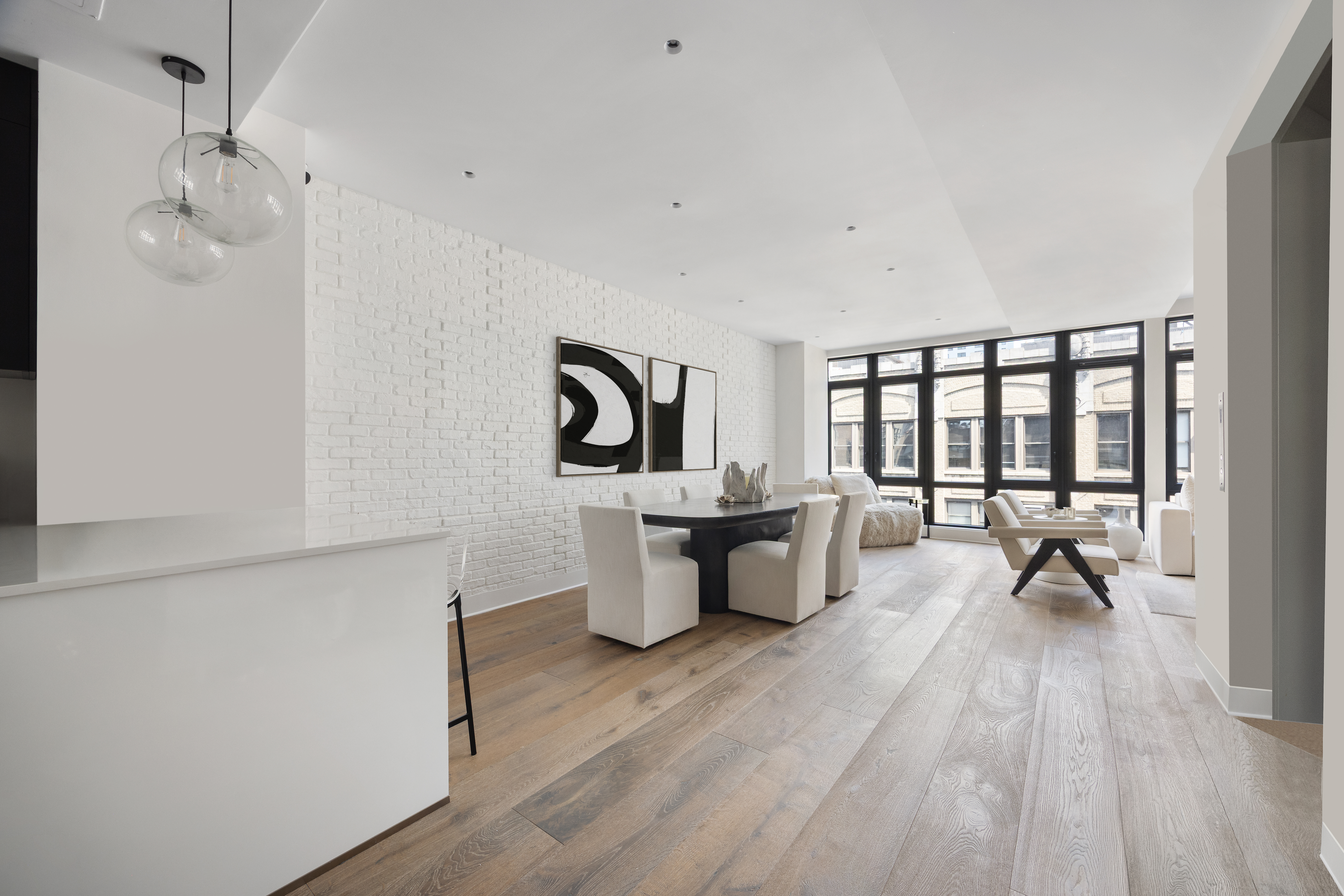 128 West 26th Street, Unit PH Manhattan, NY 10001 - Photo 6 of 21 a living room with furniture a window and a table