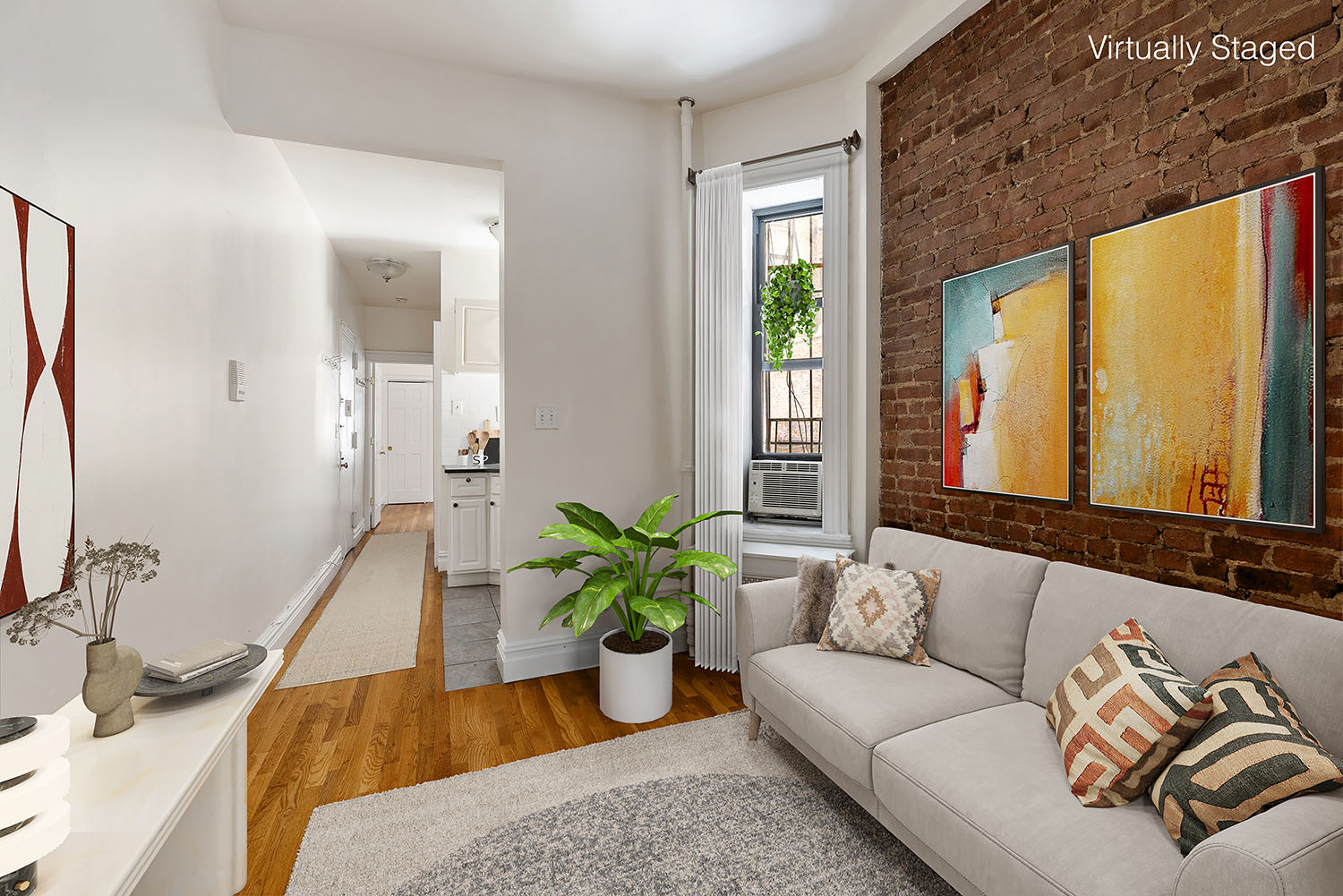 211 West 88th Street, Unit 1B Manhattan, NY 10024 - Photo 1 of 8 a living room with furniture flowerpot and wooden floor