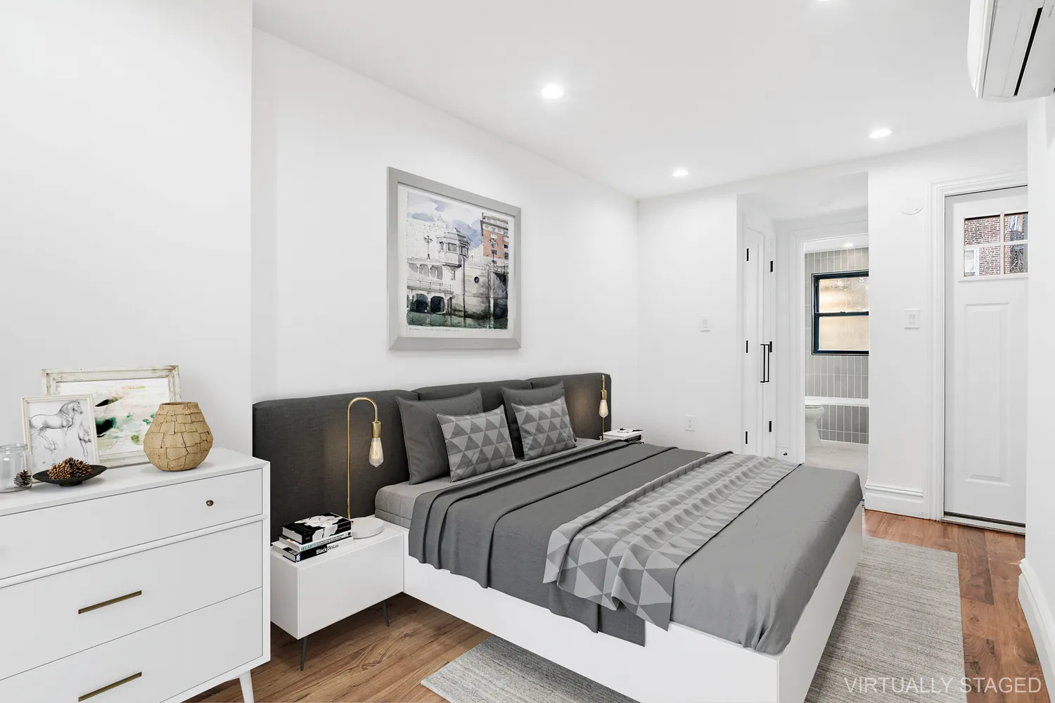 a bedroom with a bed and wooden floor