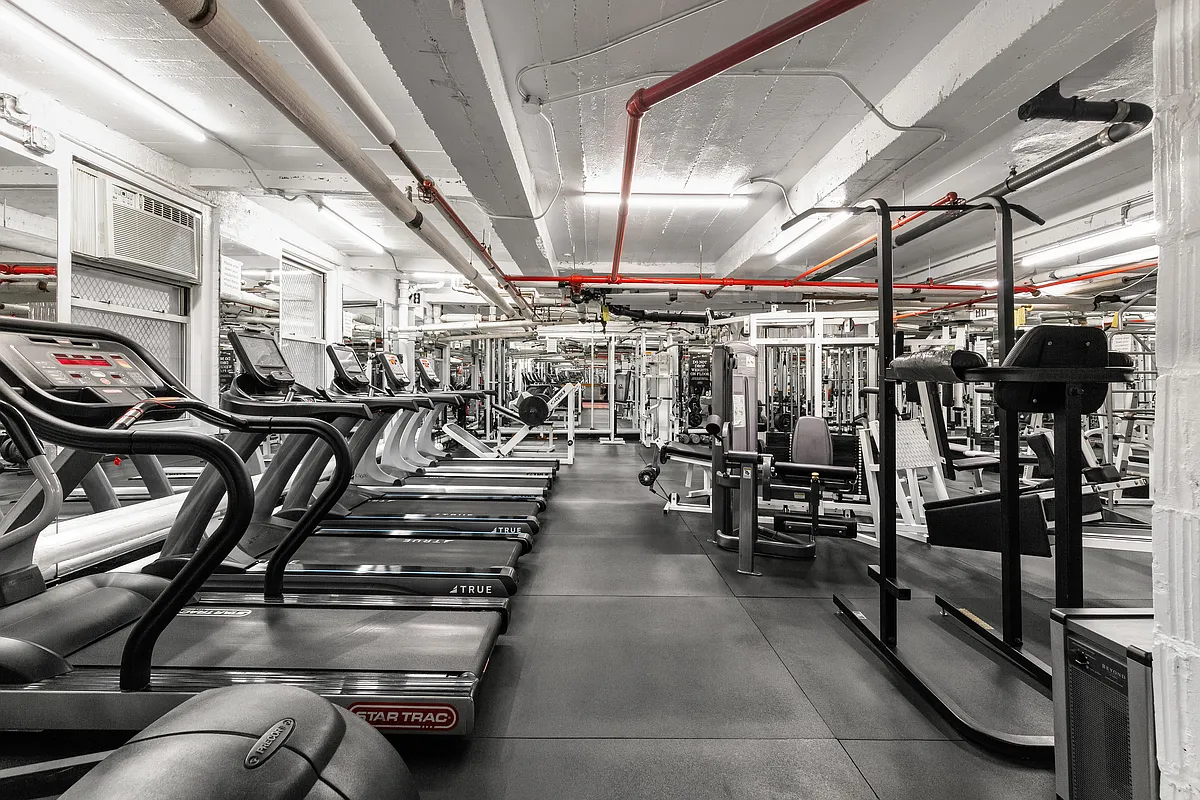 333 East 43rd Street, Unit 910 Manhattan, NY 10017 - Photo 5 of 13 a view of a room with gym equipment