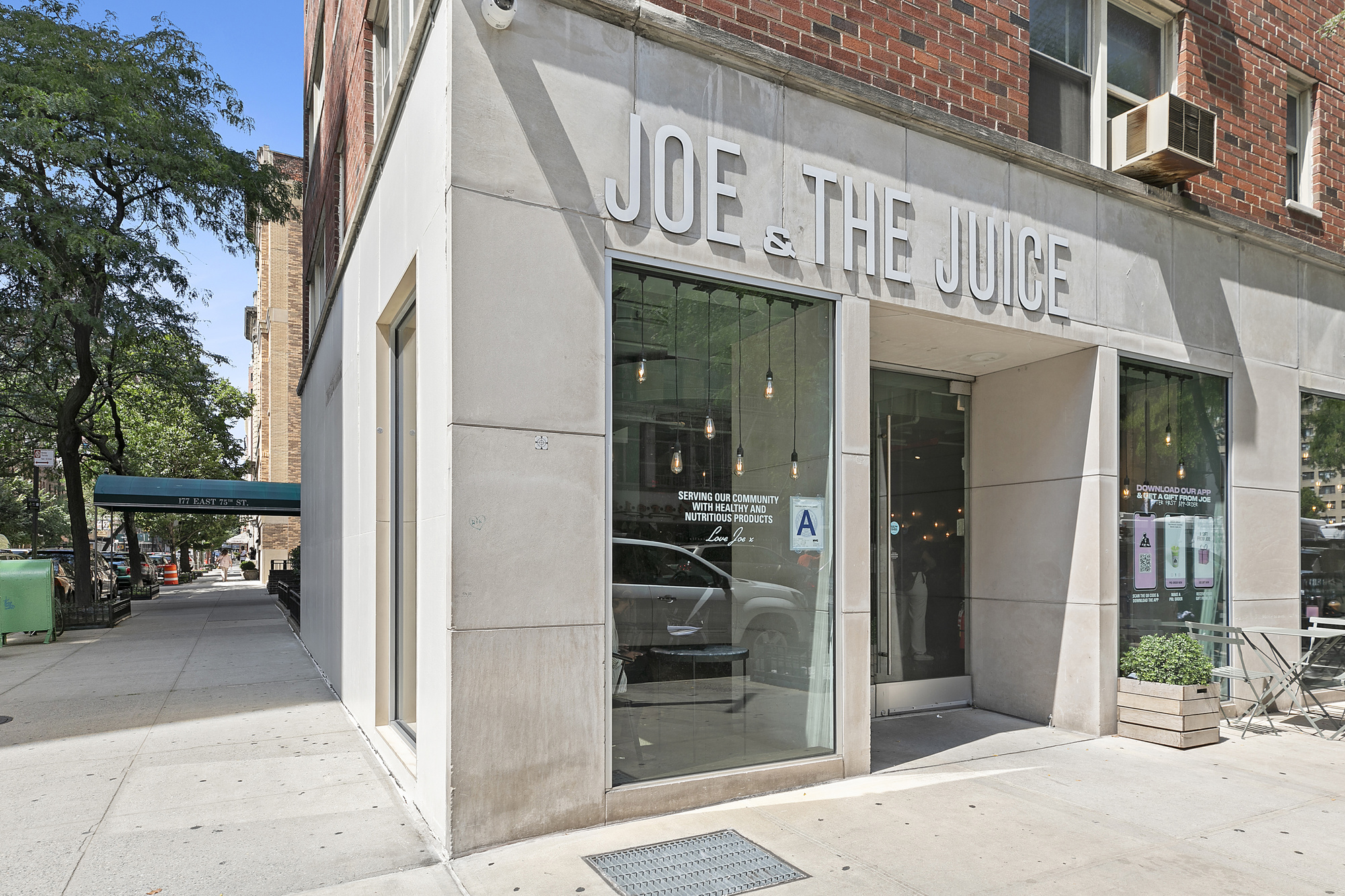 1315 3rd Avenue, Unit PH5RN Manhattan, NY 10021 - Photo 7 of 7 a view of a entrance gate of the building and a street