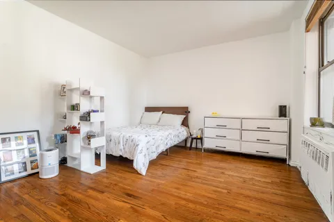 a bedroom with a bed and a cabinets