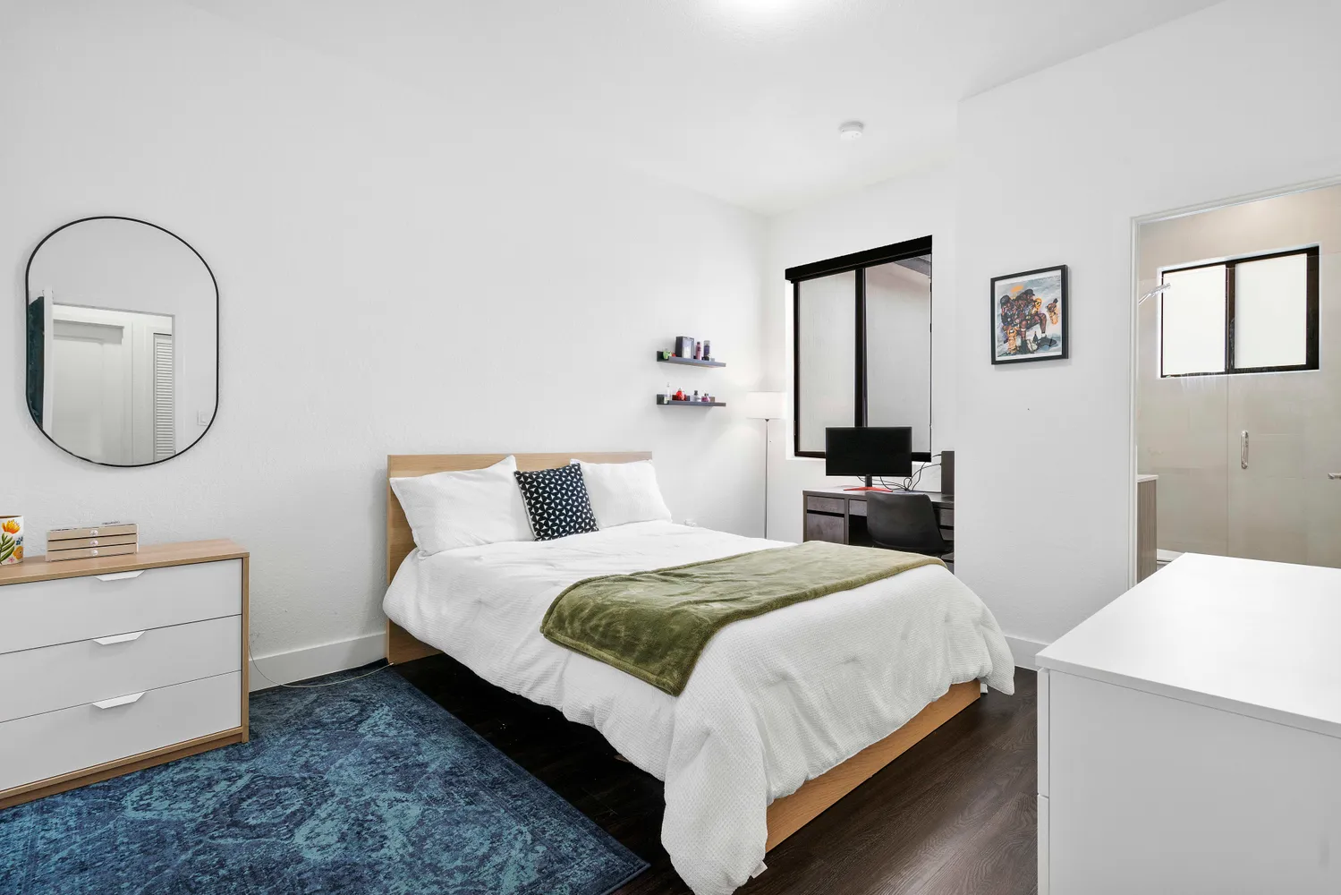 a bedroom with a bed and a dresser