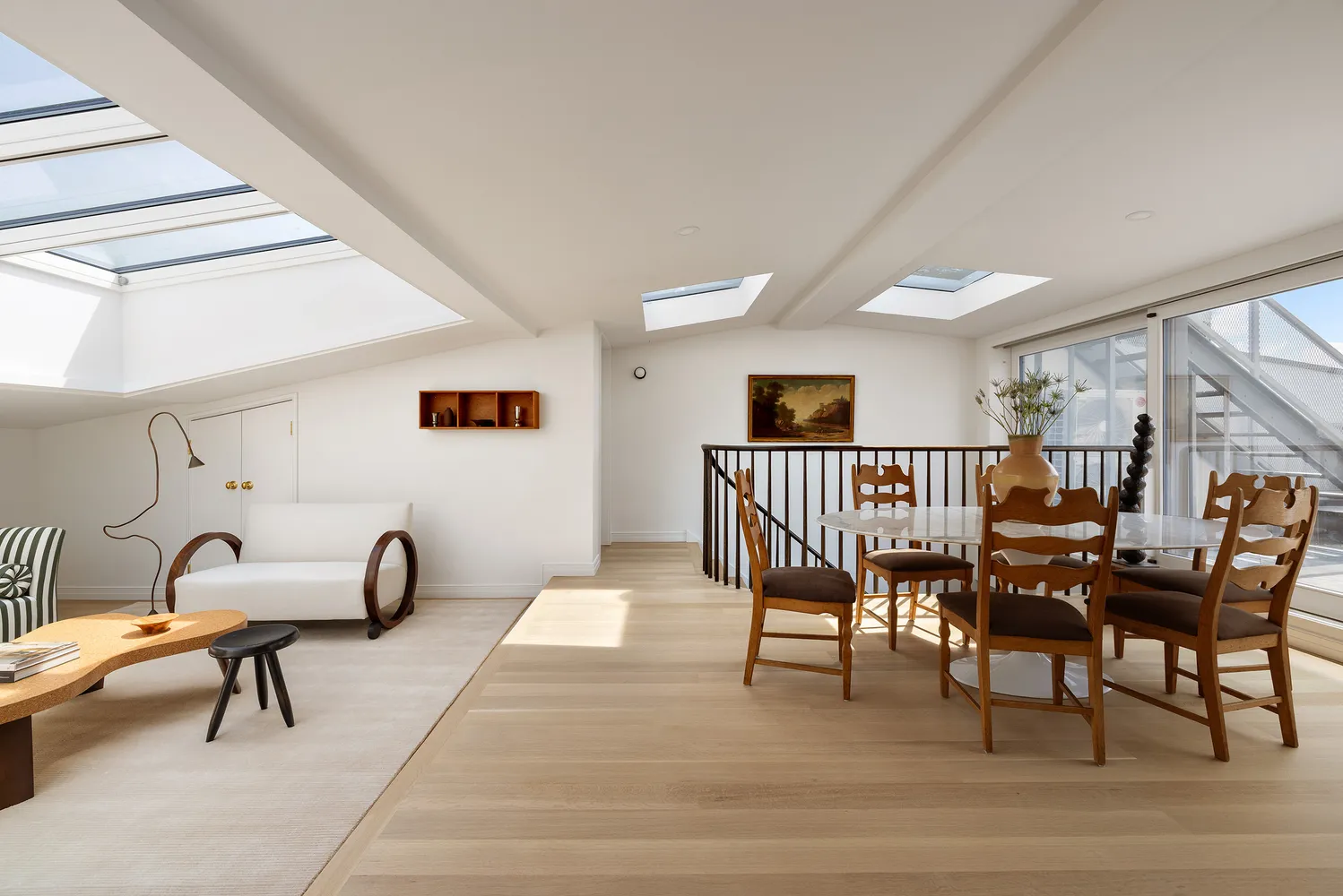 a dining room with furniture and a window