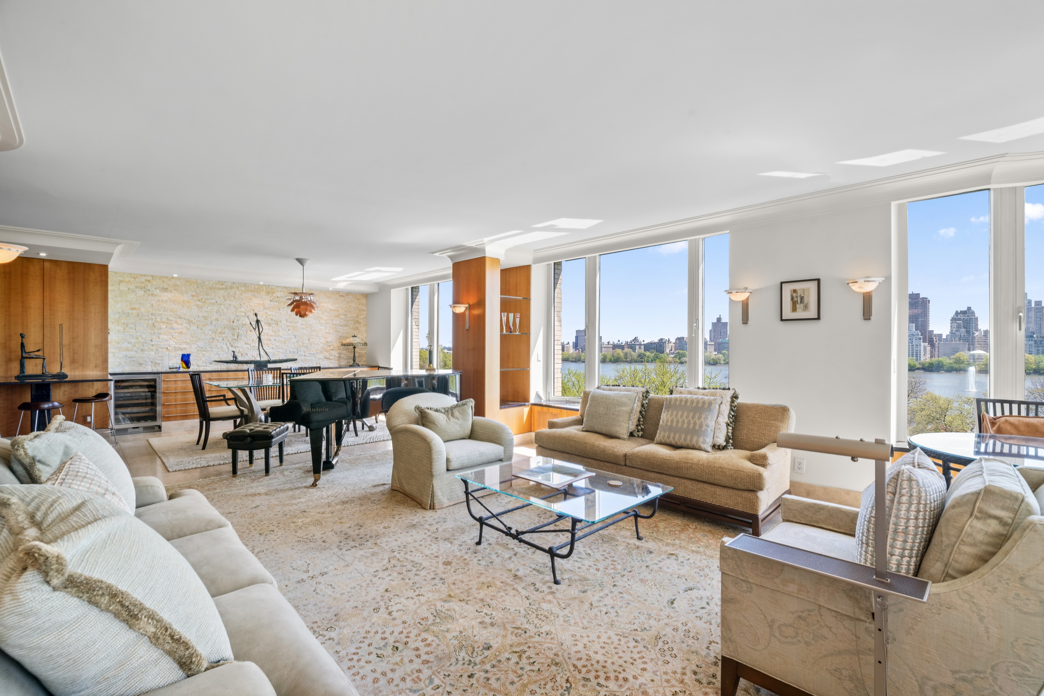 279 Central Park West, Unit 11B Manhattan, NY 10024 - Photo 2 of 24 a living room with furniture wooden floor and a large window