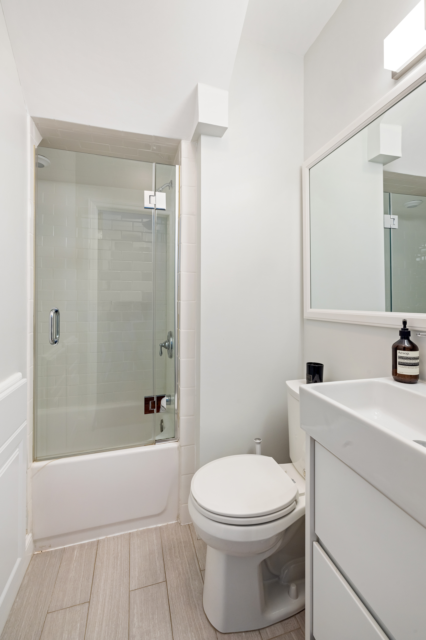 716 Monroe Street Brooklyn, NY 11221 - Photo 9 of 22 a bathroom with a sink a toilet and shower