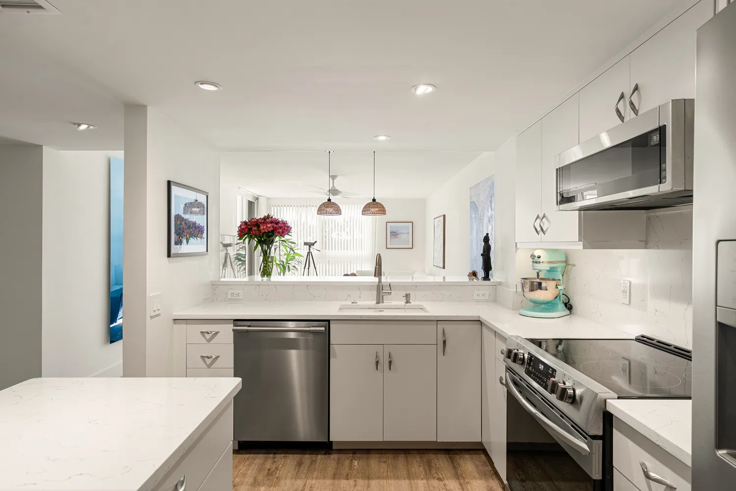 a kitchen with a sink stove and cabinets