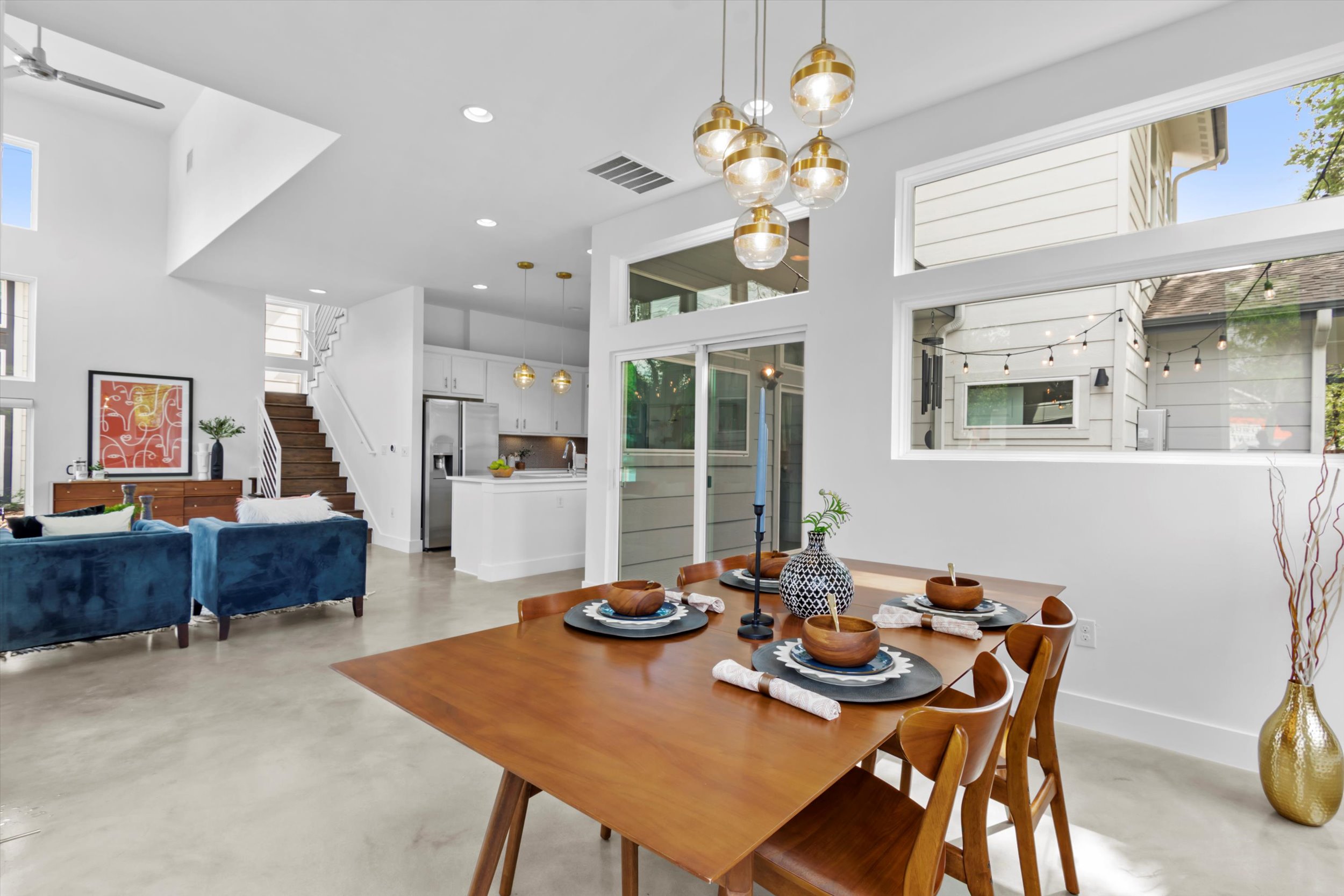 513 West Croslin Street, Unit A Austin, TX 78752 - Photo 8 of 39 a view of a dining room with furniture and chandelier