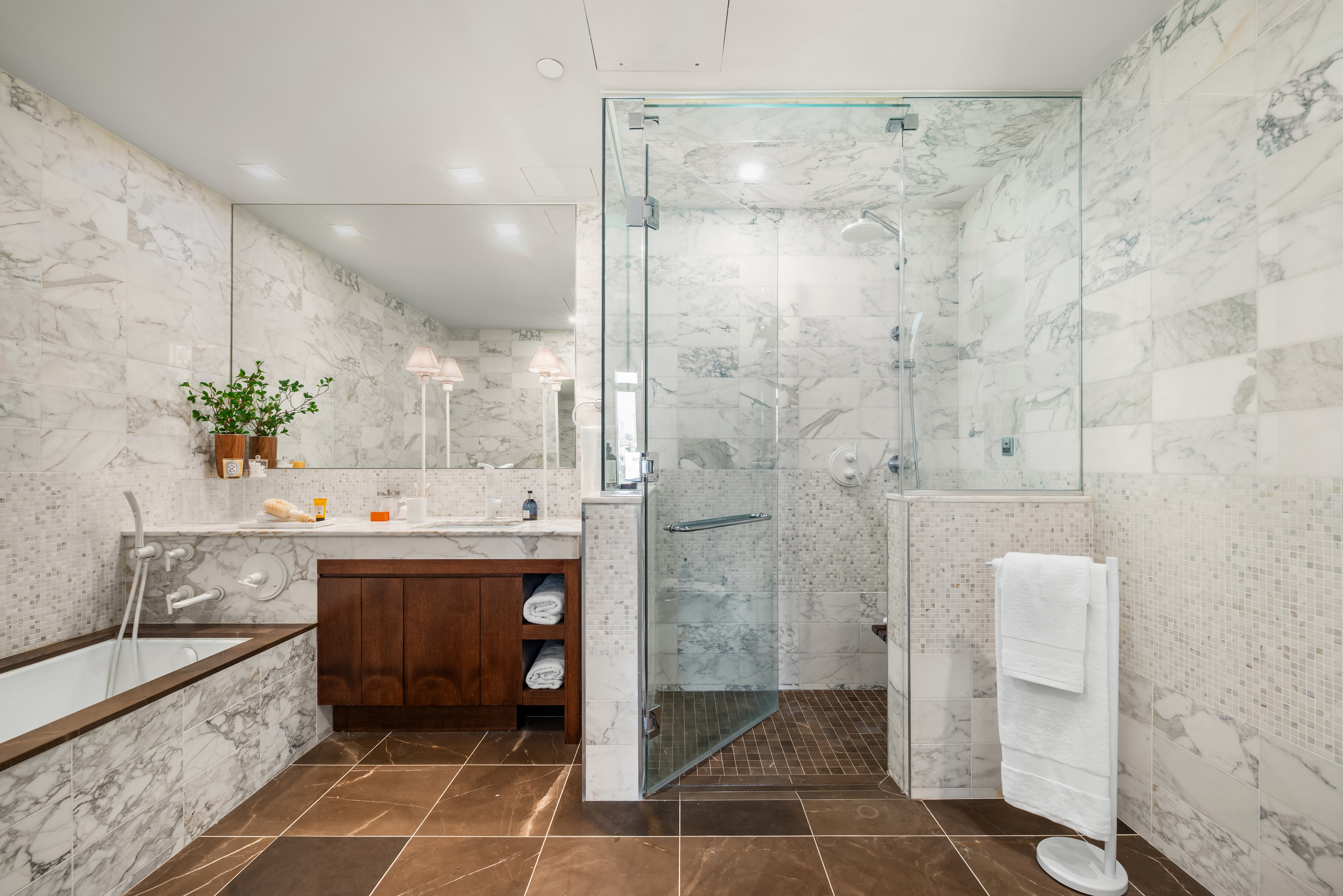 35 West 15th Street, Unit 14D Manhattan, NY 10011 - Photo 9 of 20 a spacious bathroom with a granite countertop sink a toilet and shower