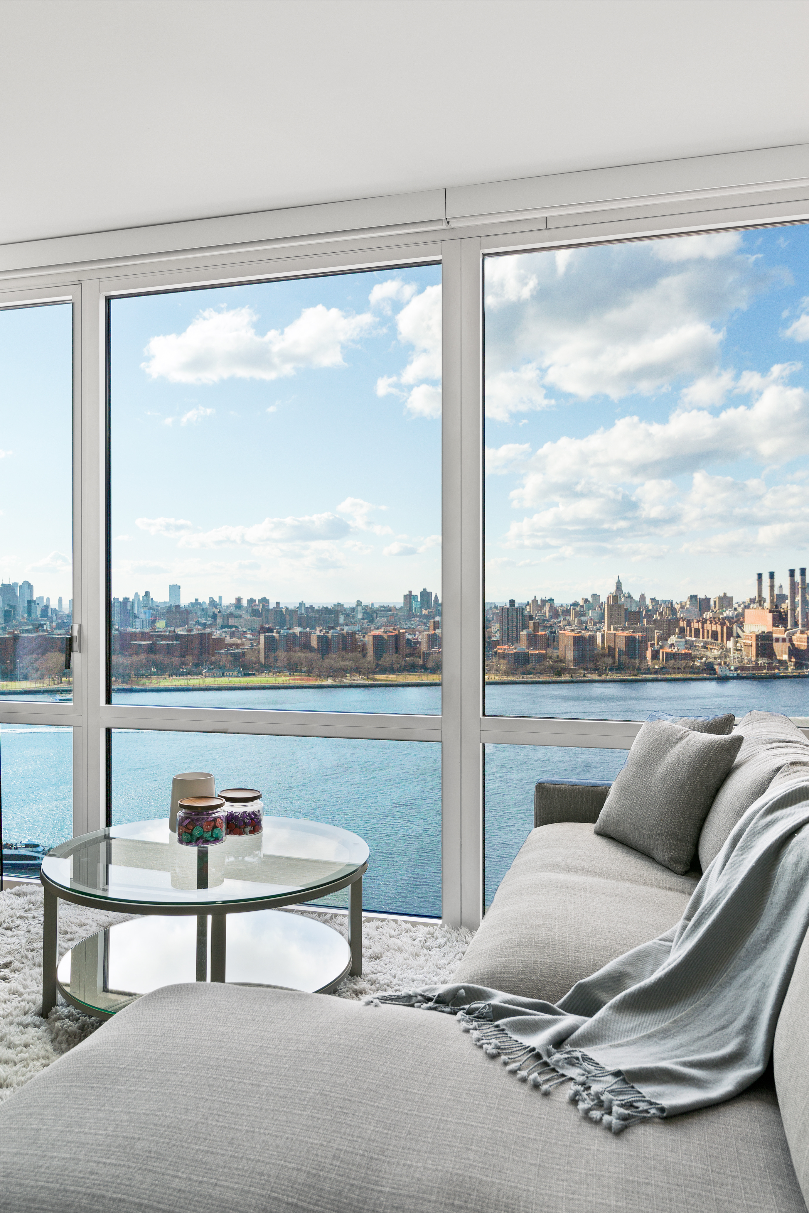 22 North 6th Street, Unit 25L Brooklyn, NY 11249 - Photo 5 of 26 a living room with furniture and a floor to ceiling window