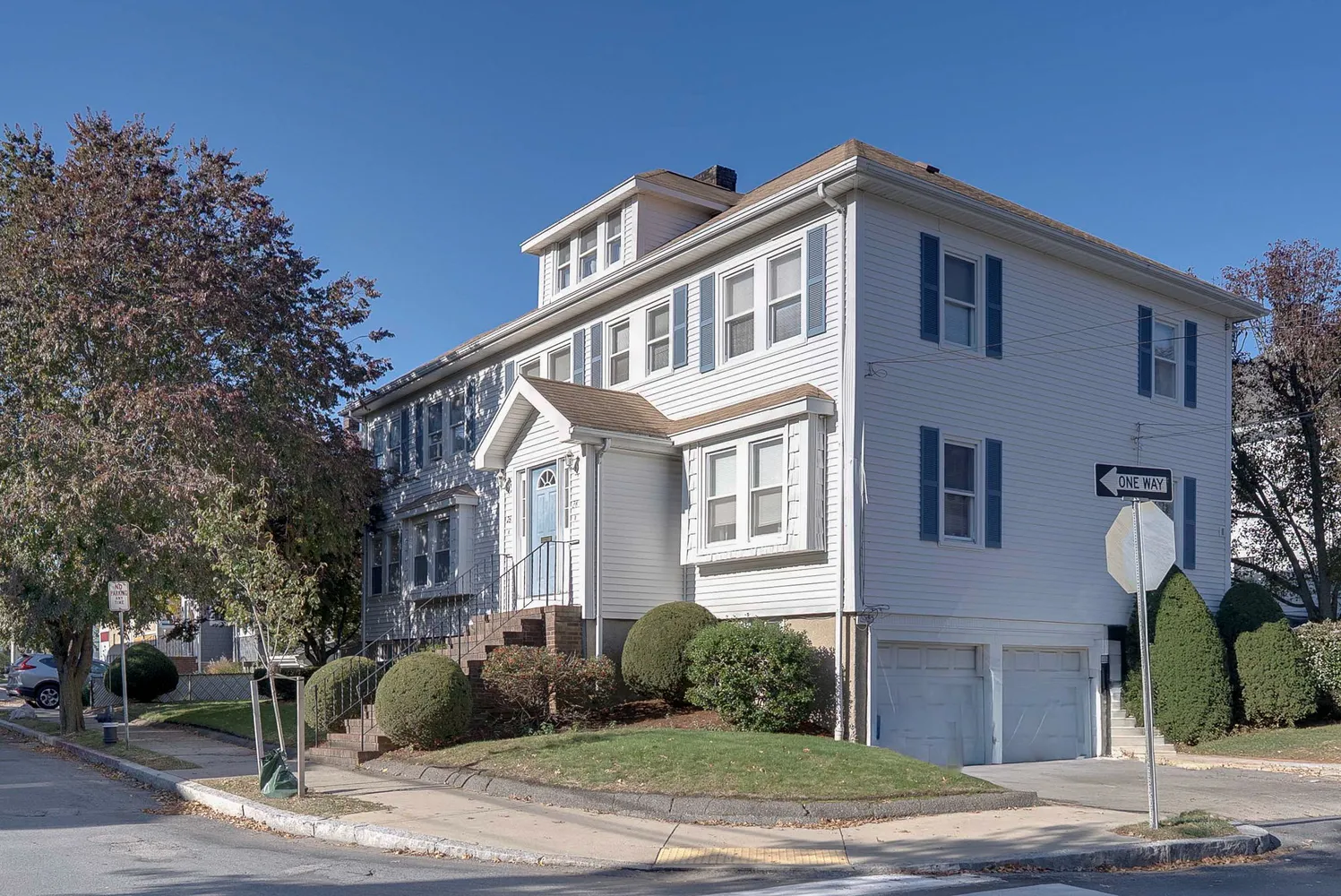a front view of a house with a yard