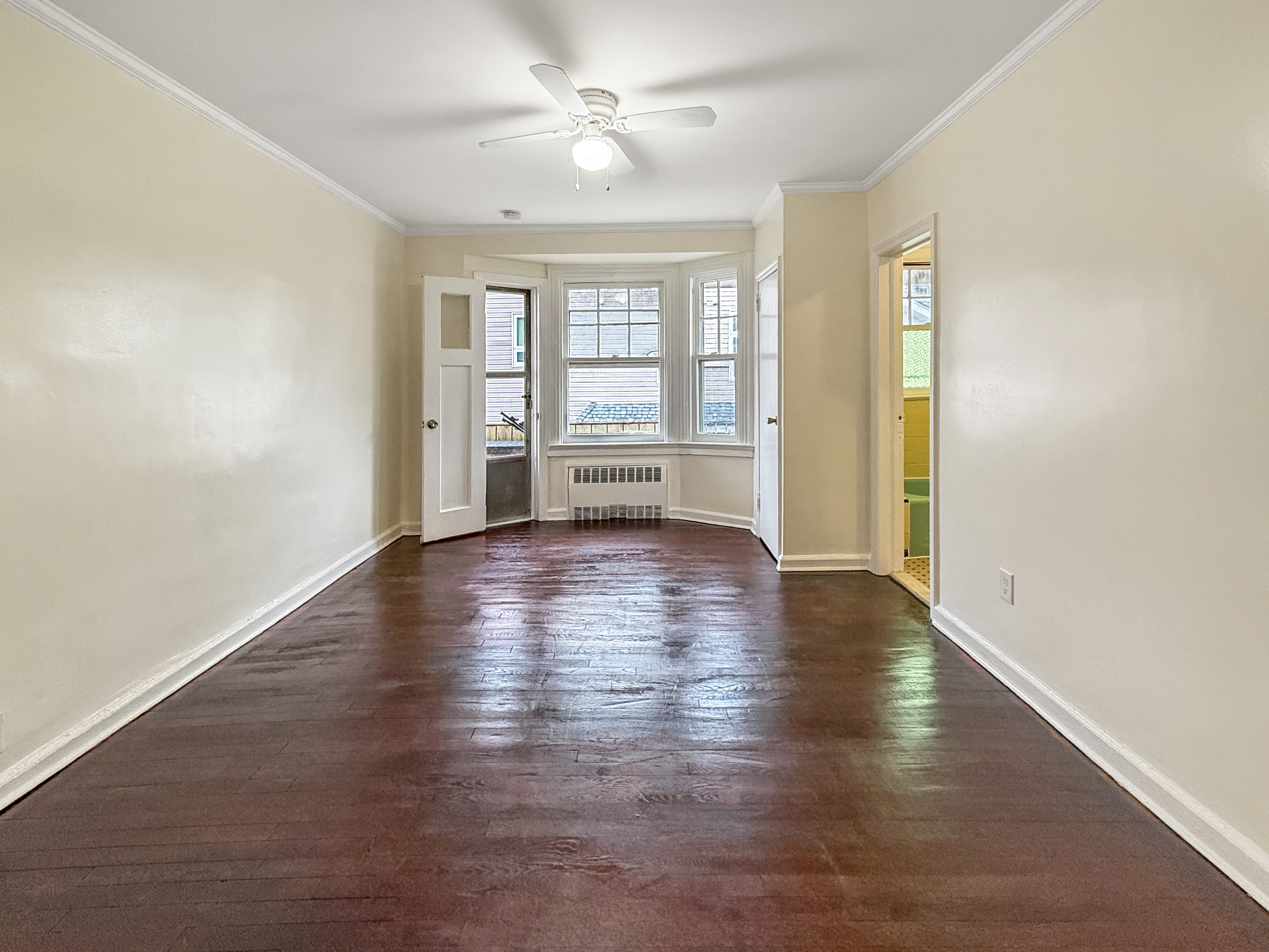 4215 Atlantic Avenue Brooklyn, NY 11224 - Photo 7 of 21 an empty room with wooden floor and windows