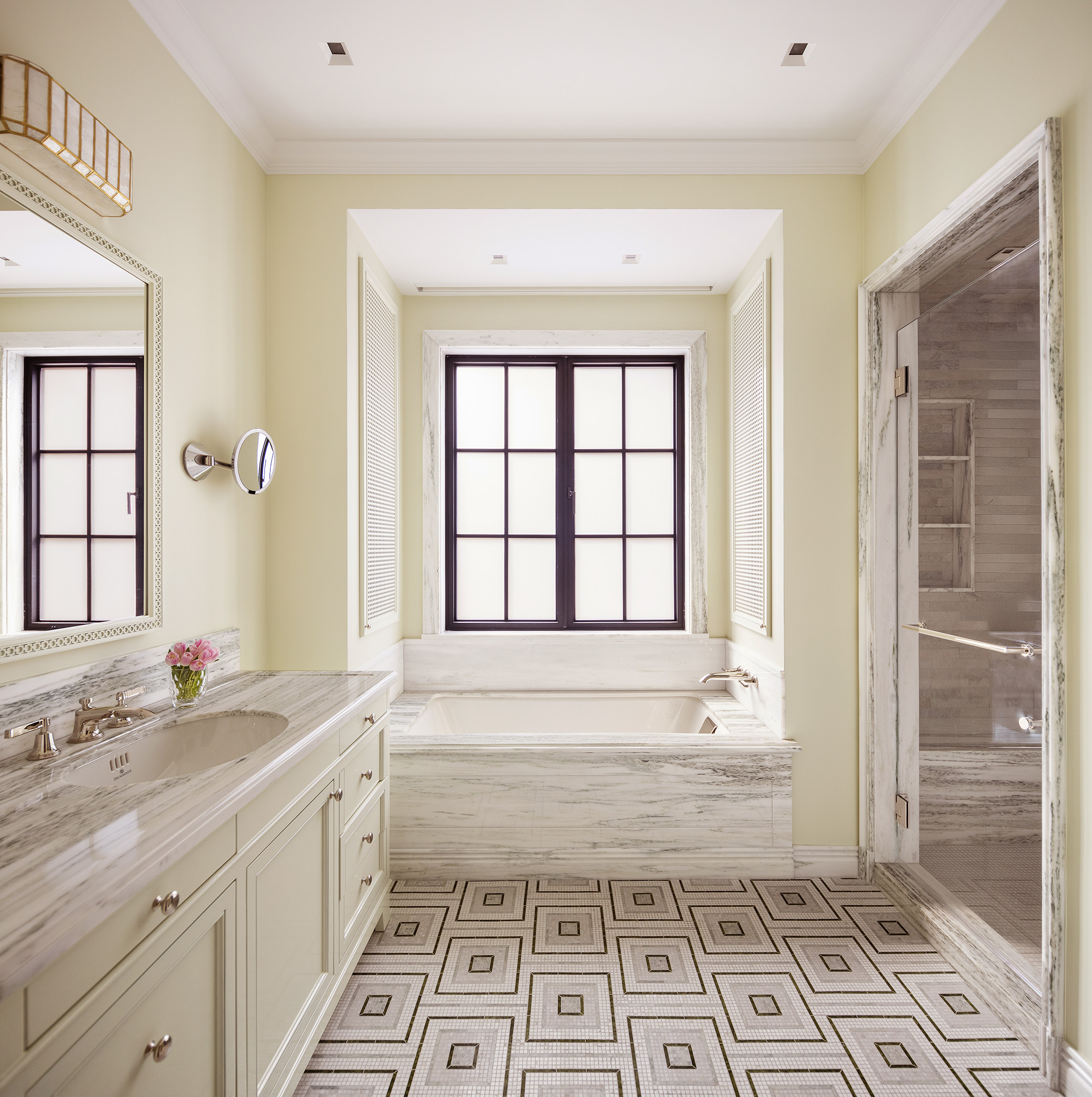 150 East 73rd Street, Unit PH Manhattan, NY 10021 - Photo 15 of 29 a bathroom with a sink a mirror and a bathtub