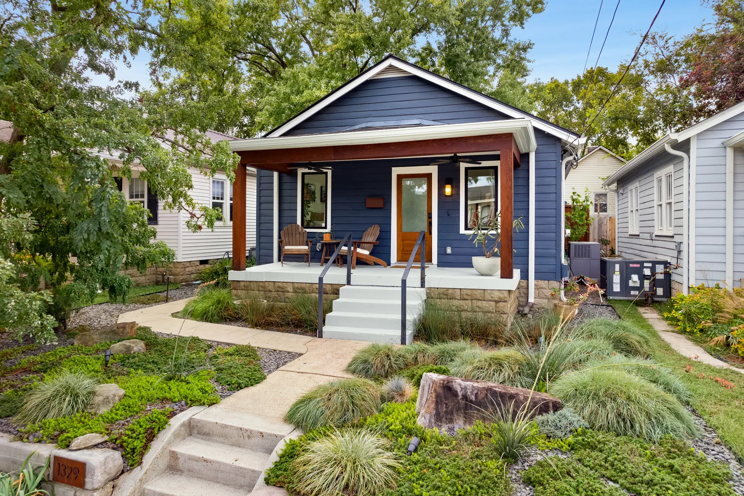 a front view of a house with garden