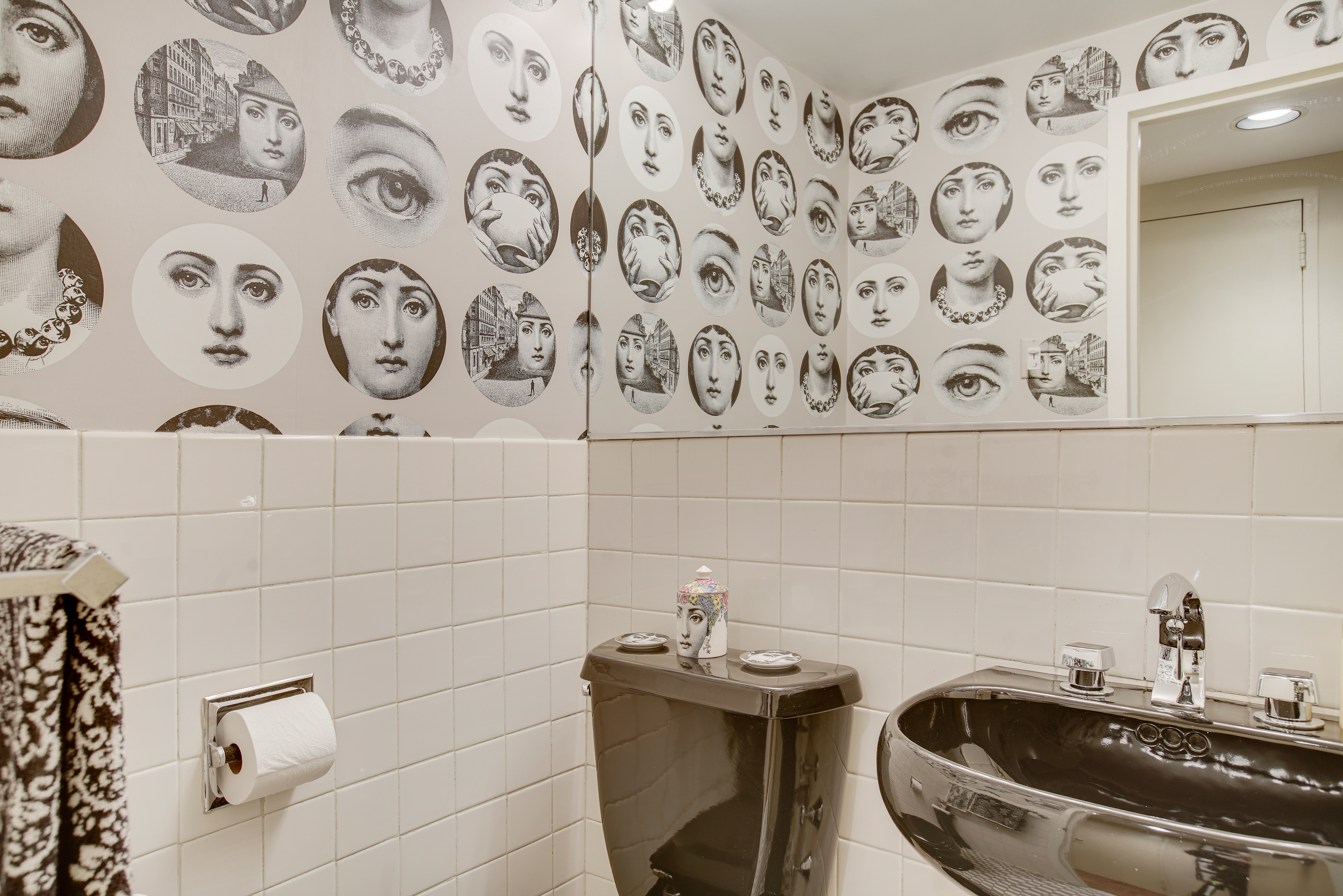 45 Sutton Place South, Unit 9O Manhattan, NY 10022 - Photo 10 of 16 a bathroom with a sink and a mirror