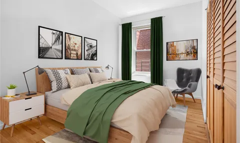 a bedroom with a bed and a painting on the wall