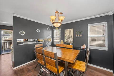 a view of a dining room with furniture and window