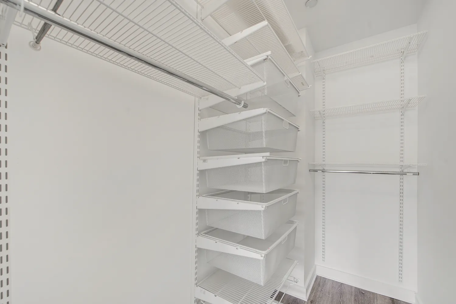 a view of an empty walk in closet