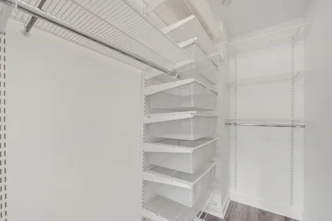 a view of an empty walk in closet