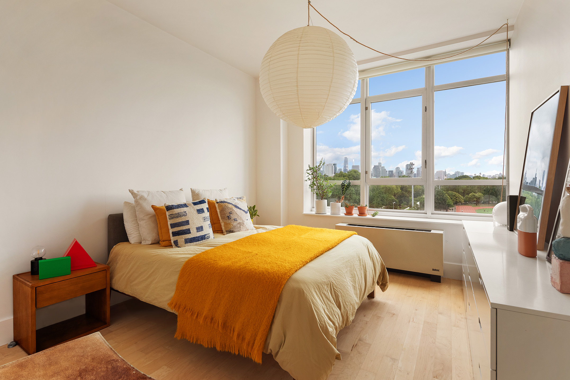 20 Bayard Street, Unit 6C Brooklyn, NY 11211 - Photo 6 of 10 a bedroom with a bed and a large window