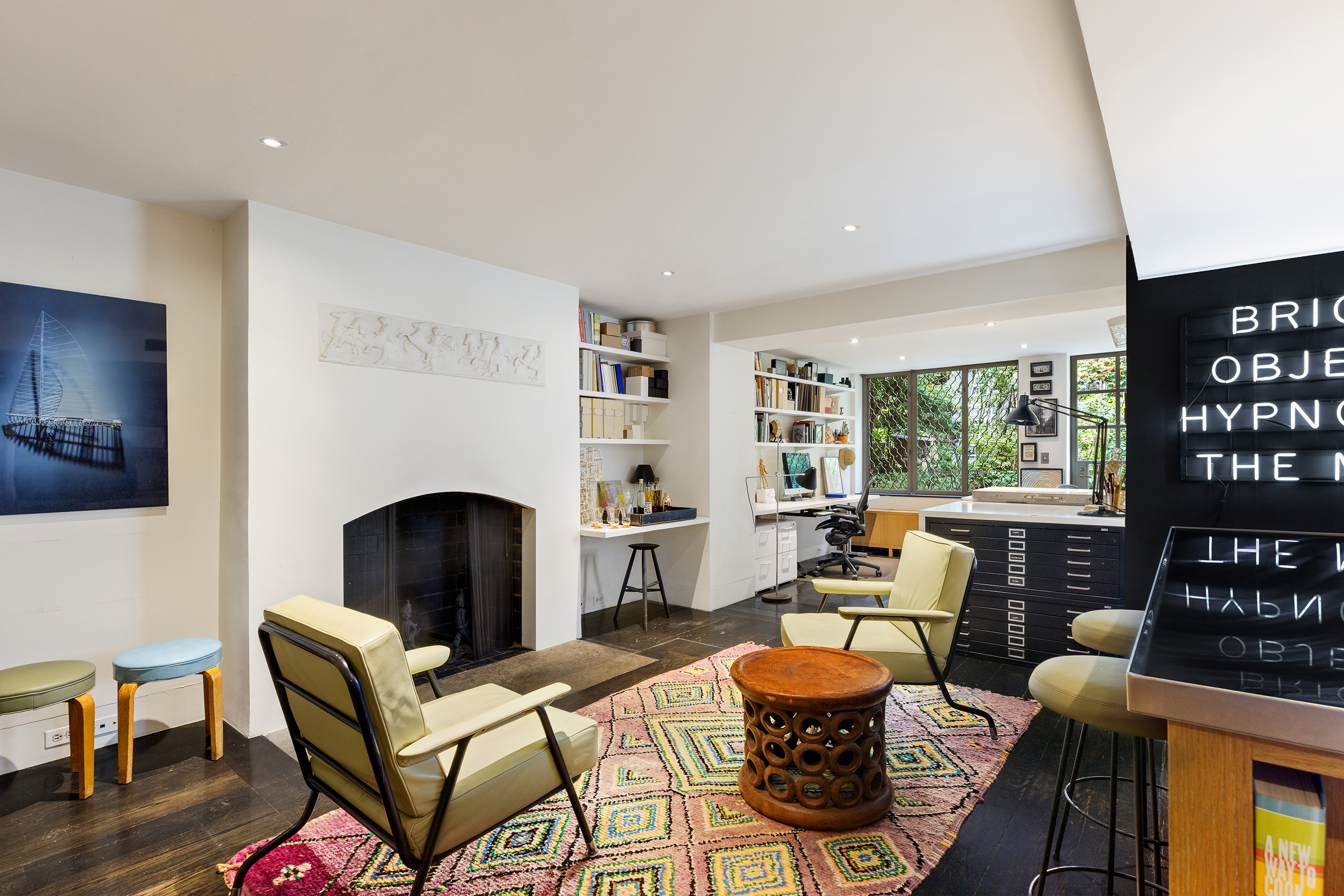 25 Perry Street Manhattan, NY 10014 - Photo 28 of 32 a living room with furniture and a fireplace