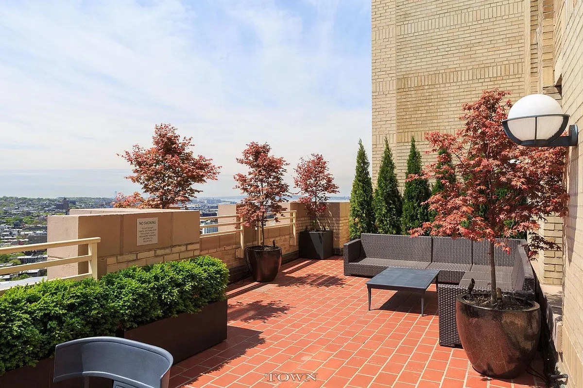 1 Hanson Place, Unit 16F Brooklyn, NY 11243 - Photo 10 of 15 a view of a chairs and table on the terrace