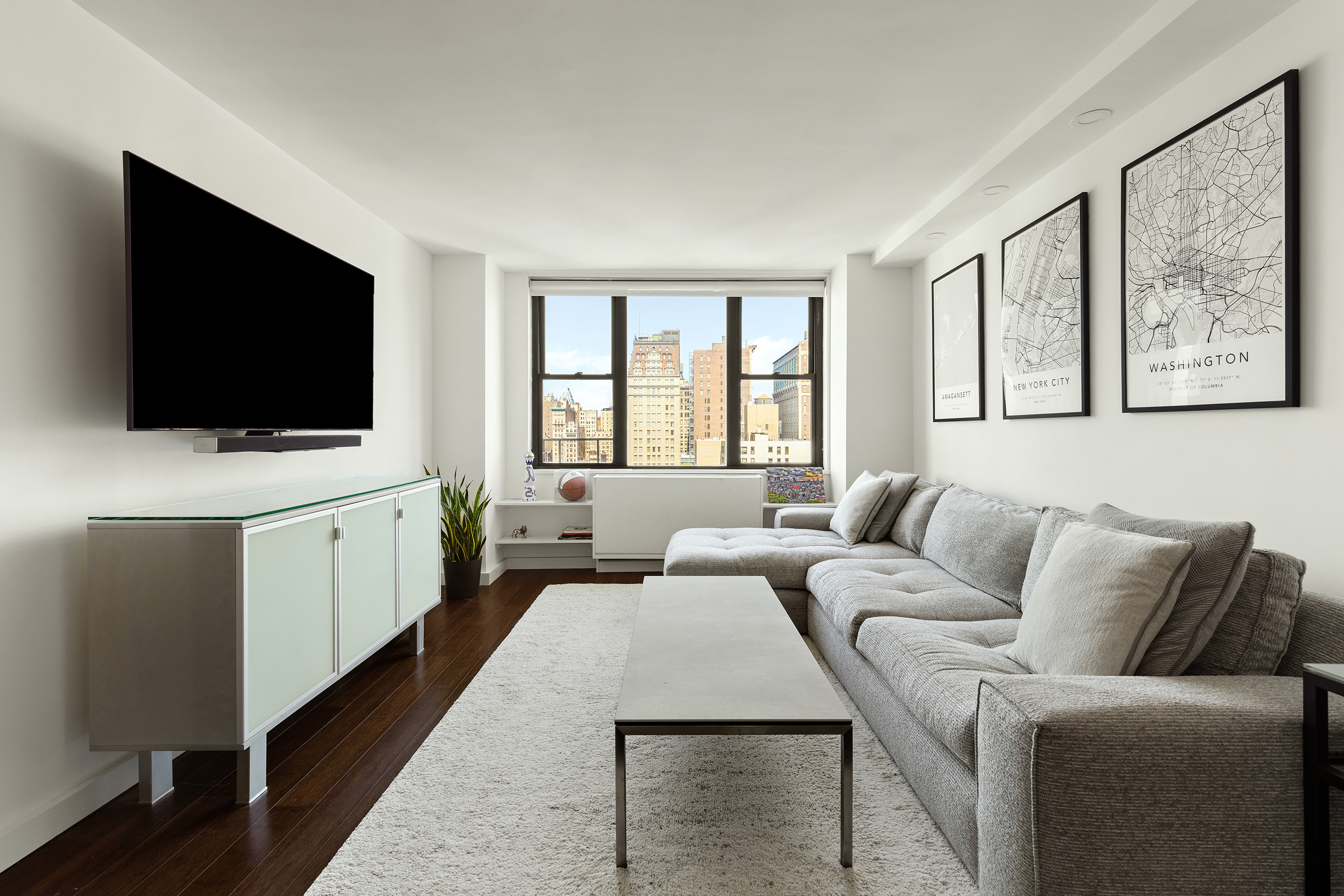 a living room with furniture and a flat screen tv