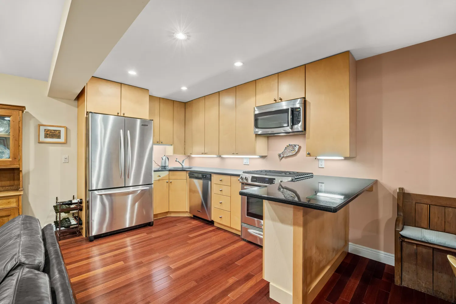 a kitchen with a sink stove and refrigerator