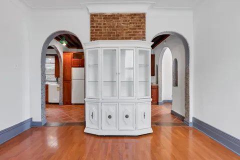 a view of entryway with wooden floor