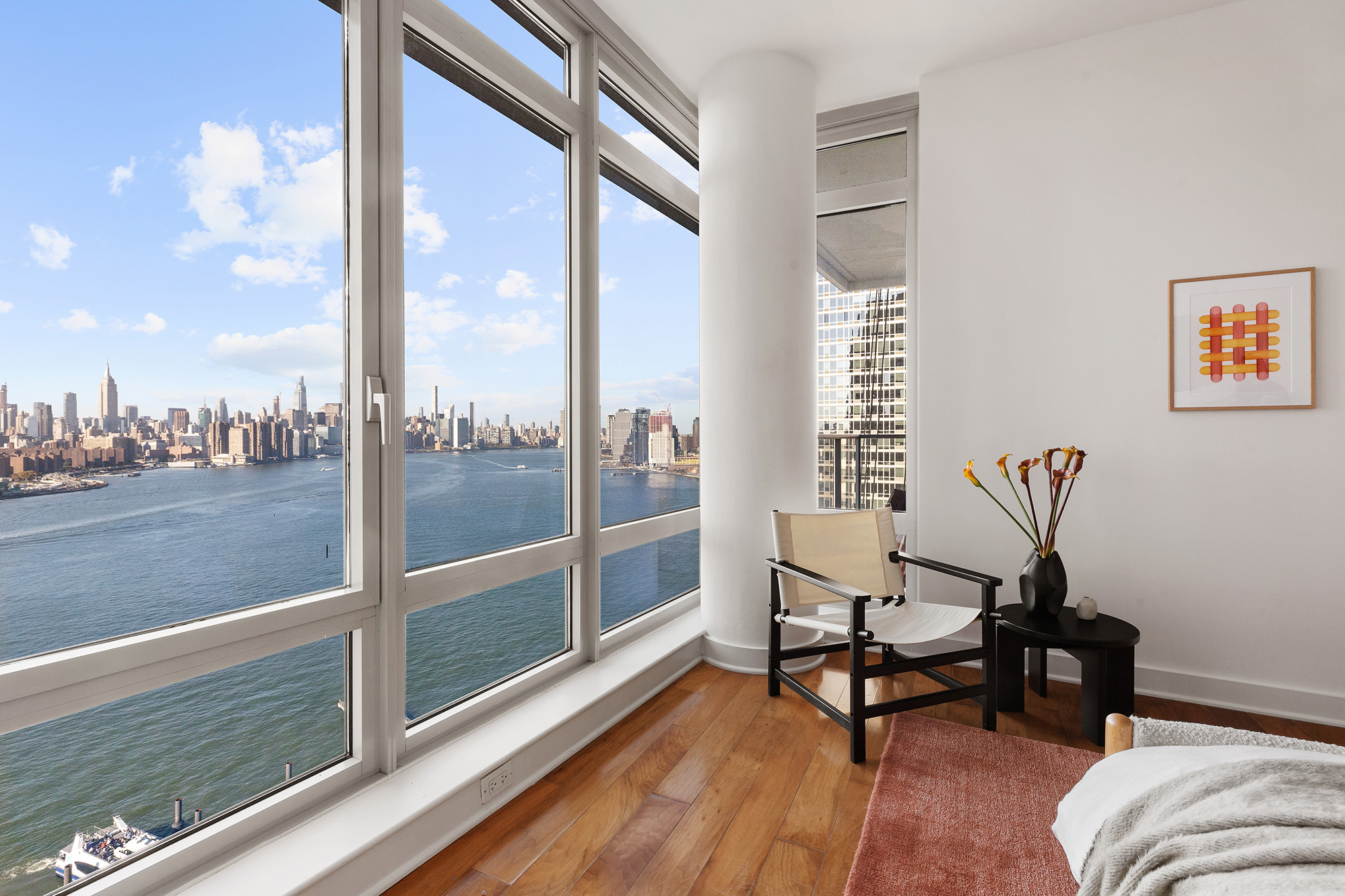 2 Northside Piers, Unit 25P Brooklyn, NY 11249 - Photo 11 of 26 a living room with furniture and a floor to ceiling window