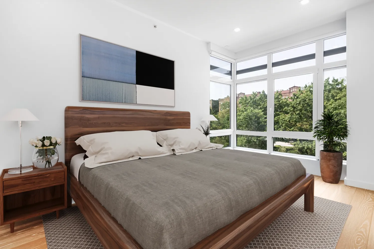 a bedroom with a large bed and a large window