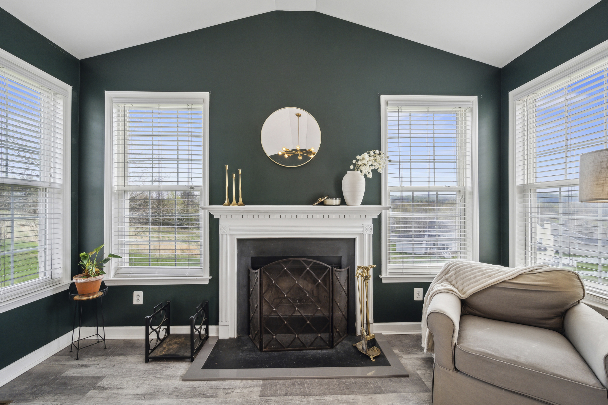 127 Hartman Road Pottstown, PA 19465 - Photo 13 of 42 a living room with furniture chandelier and a fireplace