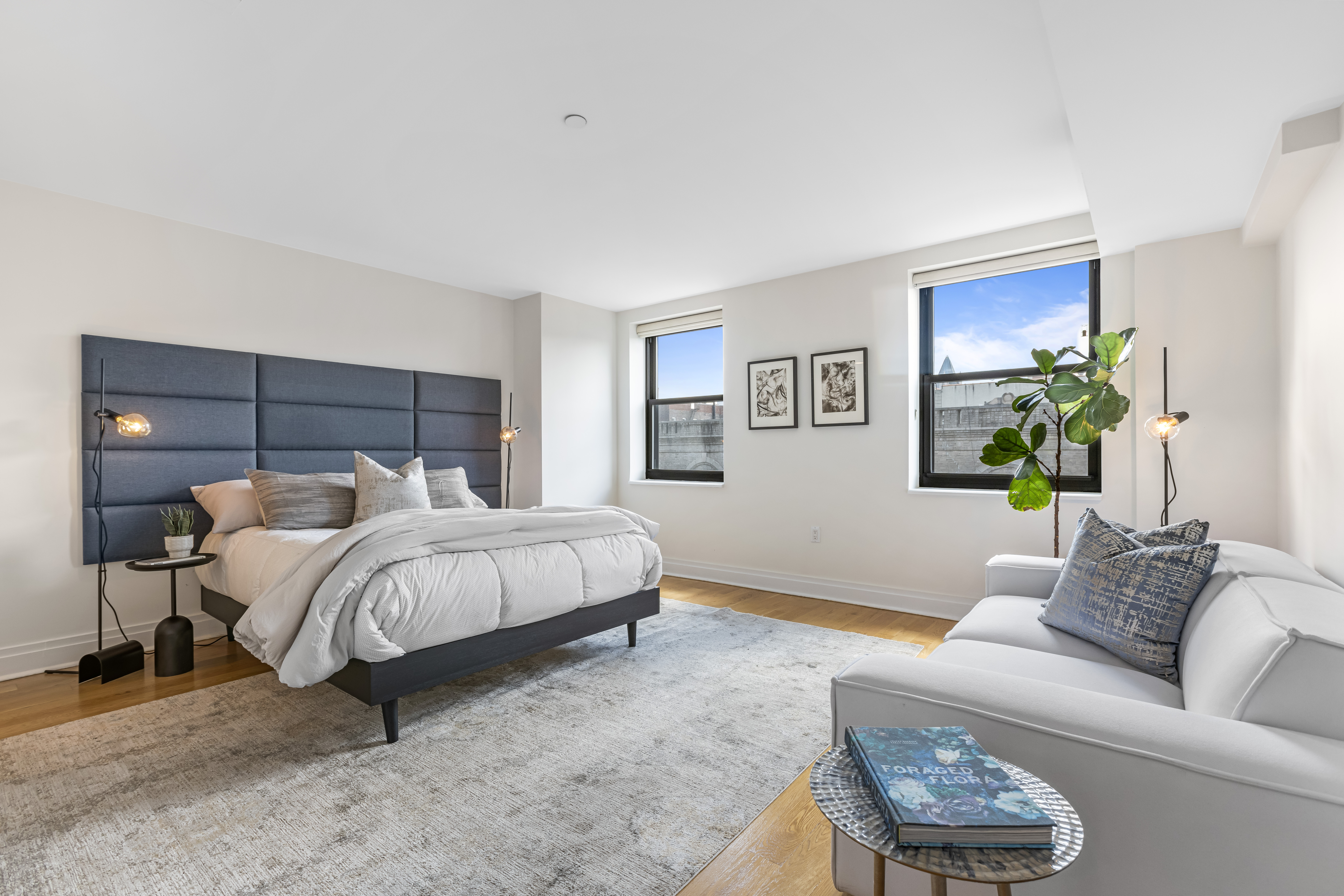 257 West 117th Street, Unit 6A Manhattan, NY 10026 - Photo 8 of 16 a bed room with a bed and a couch