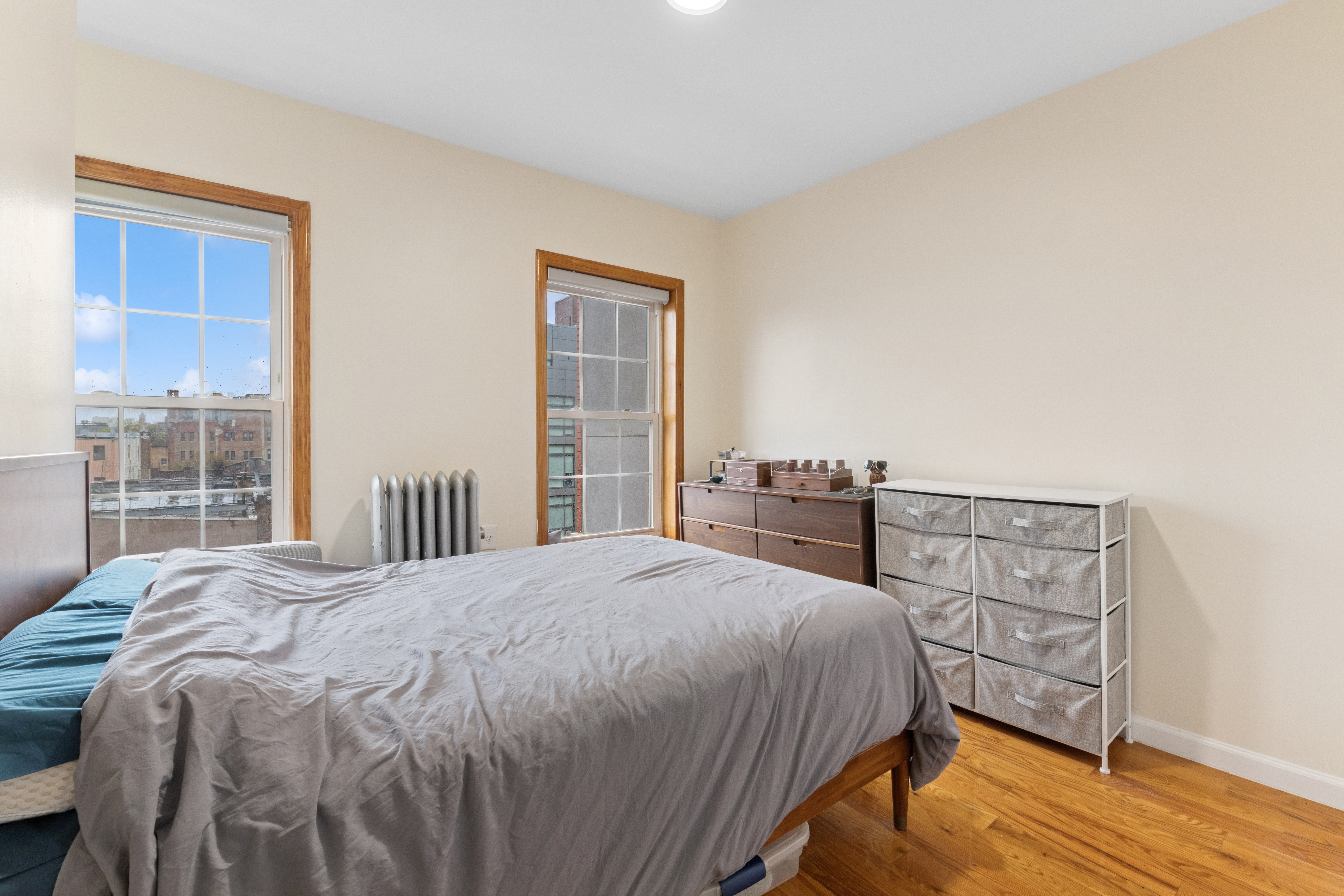 514 Classon Avenue, Unit 3 Brooklyn, NY 11238 - Photo 4 of 7 a bedroom with a bed and wooden floor