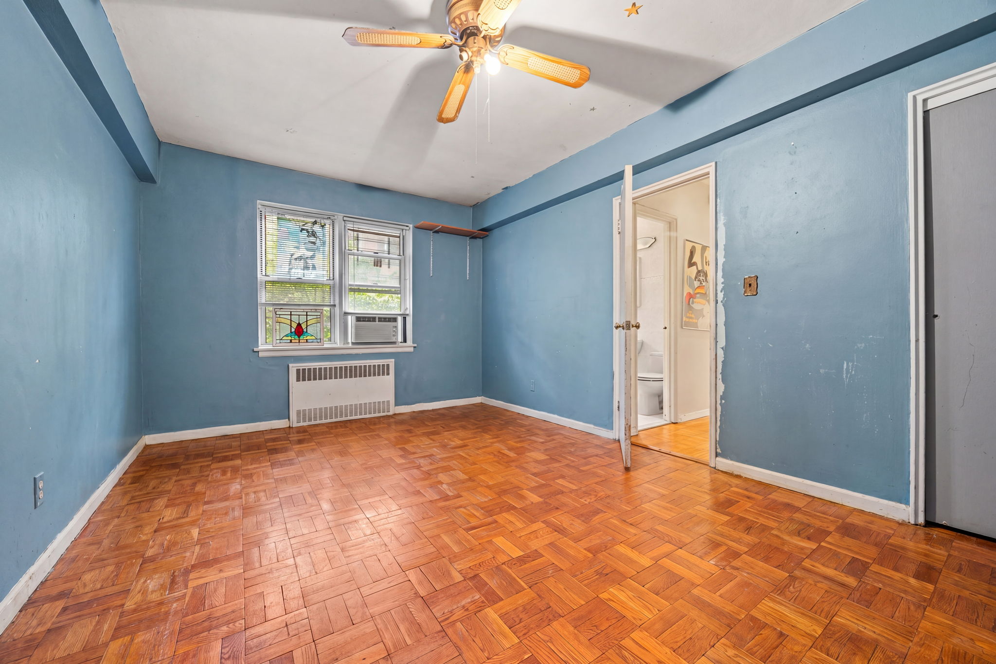 3850 Hudson Manor Terrace, Unit 1EE/2EE Bronx, NY 10463 - Photo 8 of 27 a view of empty room with window and ceiling fan