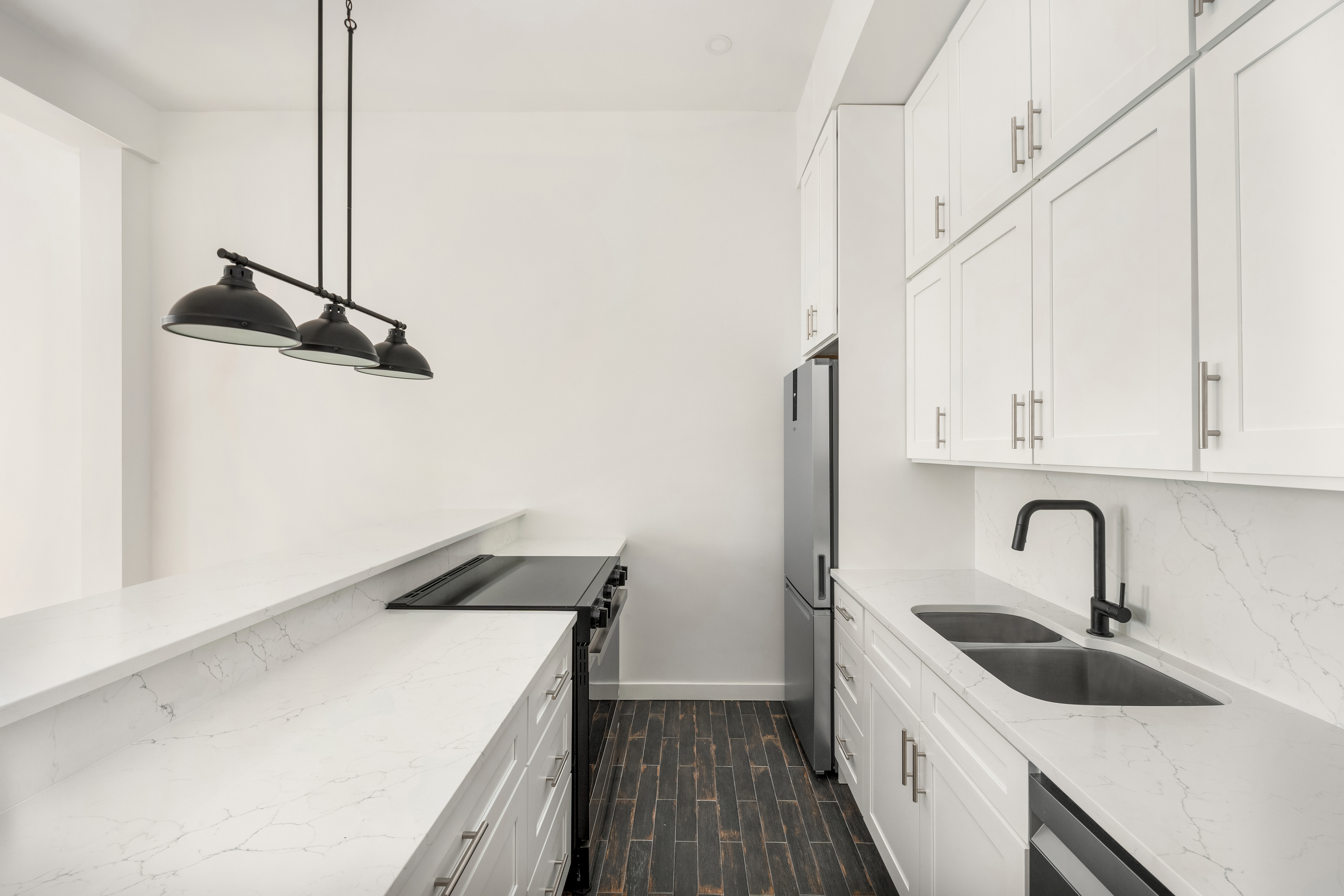 23 East 10th Street, Unit 3F Manhattan, NY 10003 - Photo 6 of 18 a kitchen that has a sink and a stove