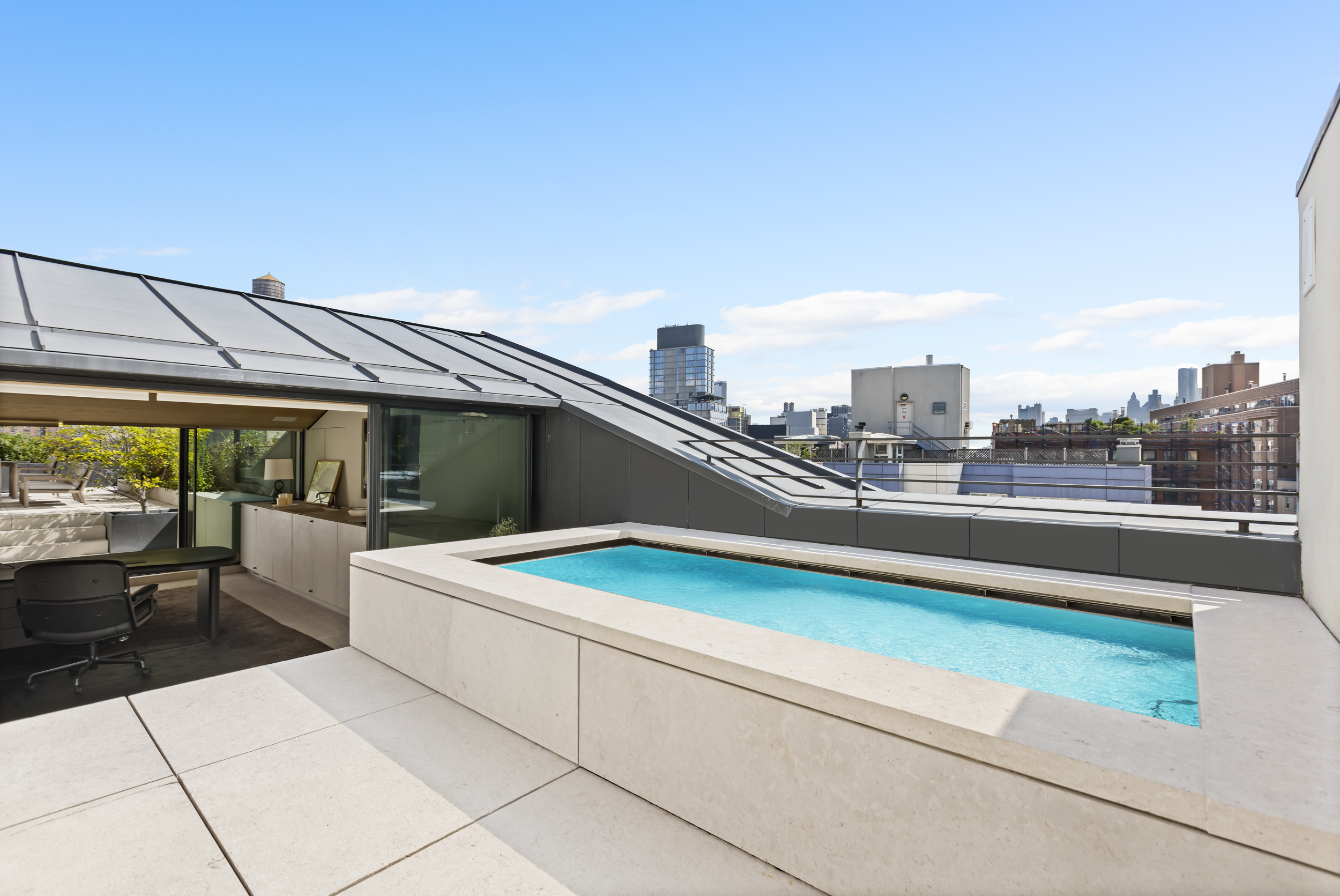 54 Bond Street, Unit PH Manhattan, NY 10012 - Photo 24 of 31 a terrace with a table and chairs