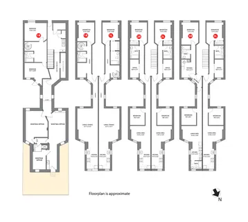 a living room with furniture and baby bed