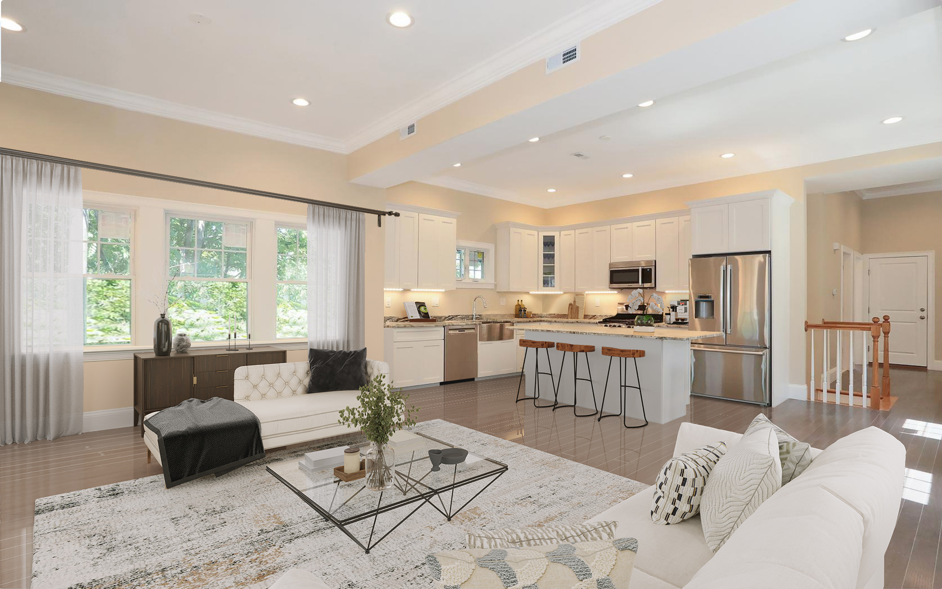 a living room with kitchen island furniture and a large window