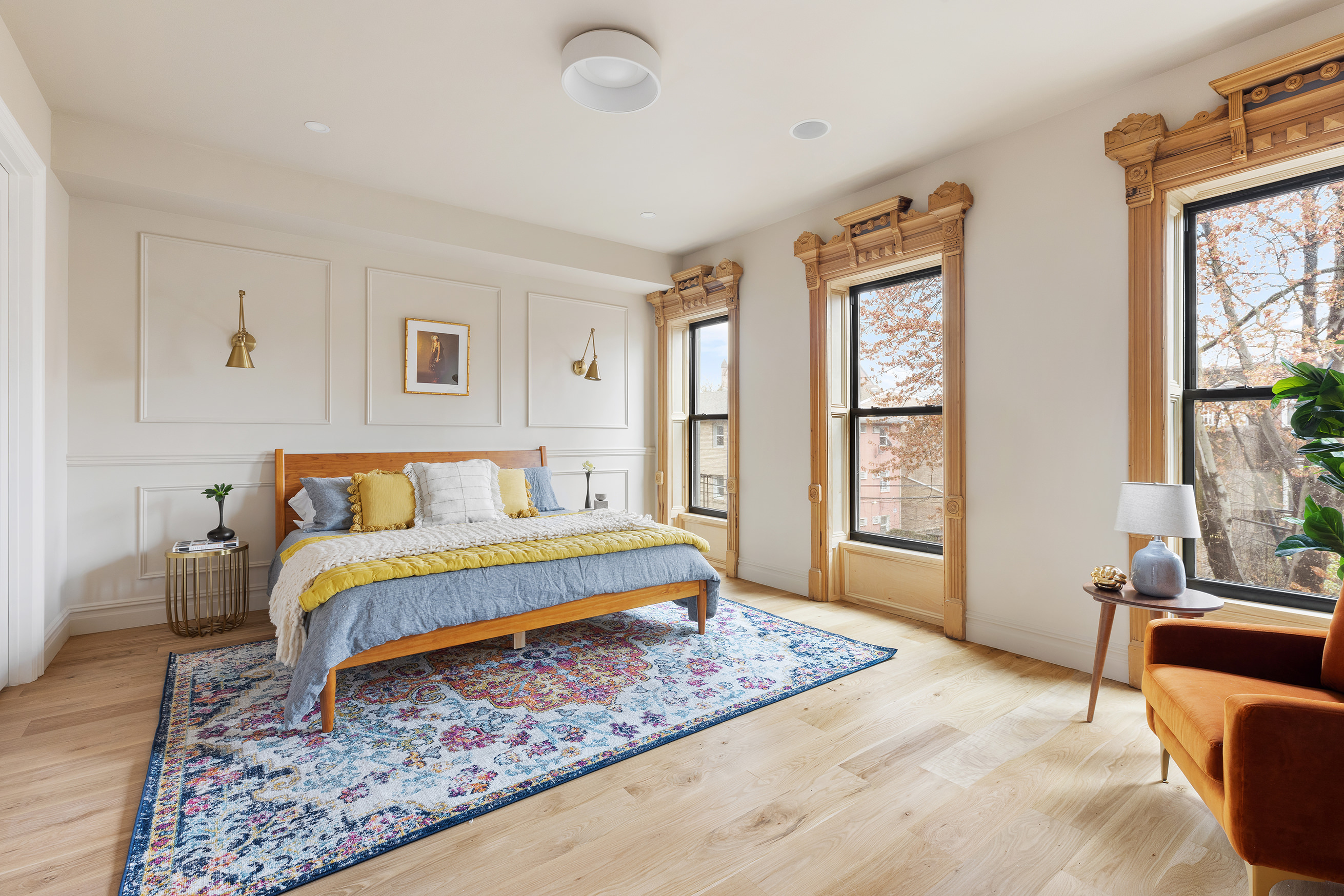 816 Lafayette Avenue, Unit MF Brooklyn, NY 11221 - Photo 11 of 22 a spacious bedroom with a bed a couch and large window